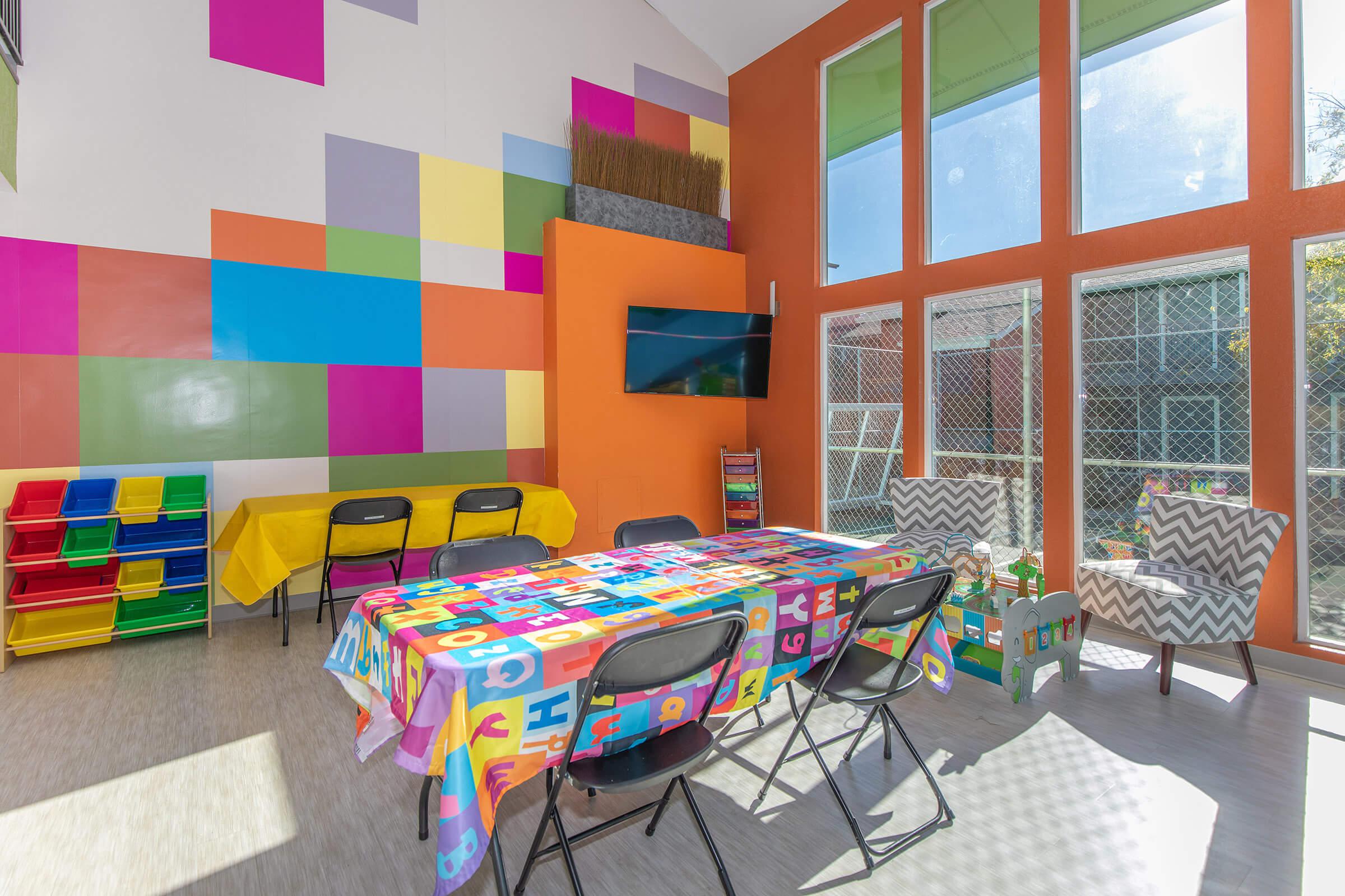 a colorful kite sitting on top of a bed