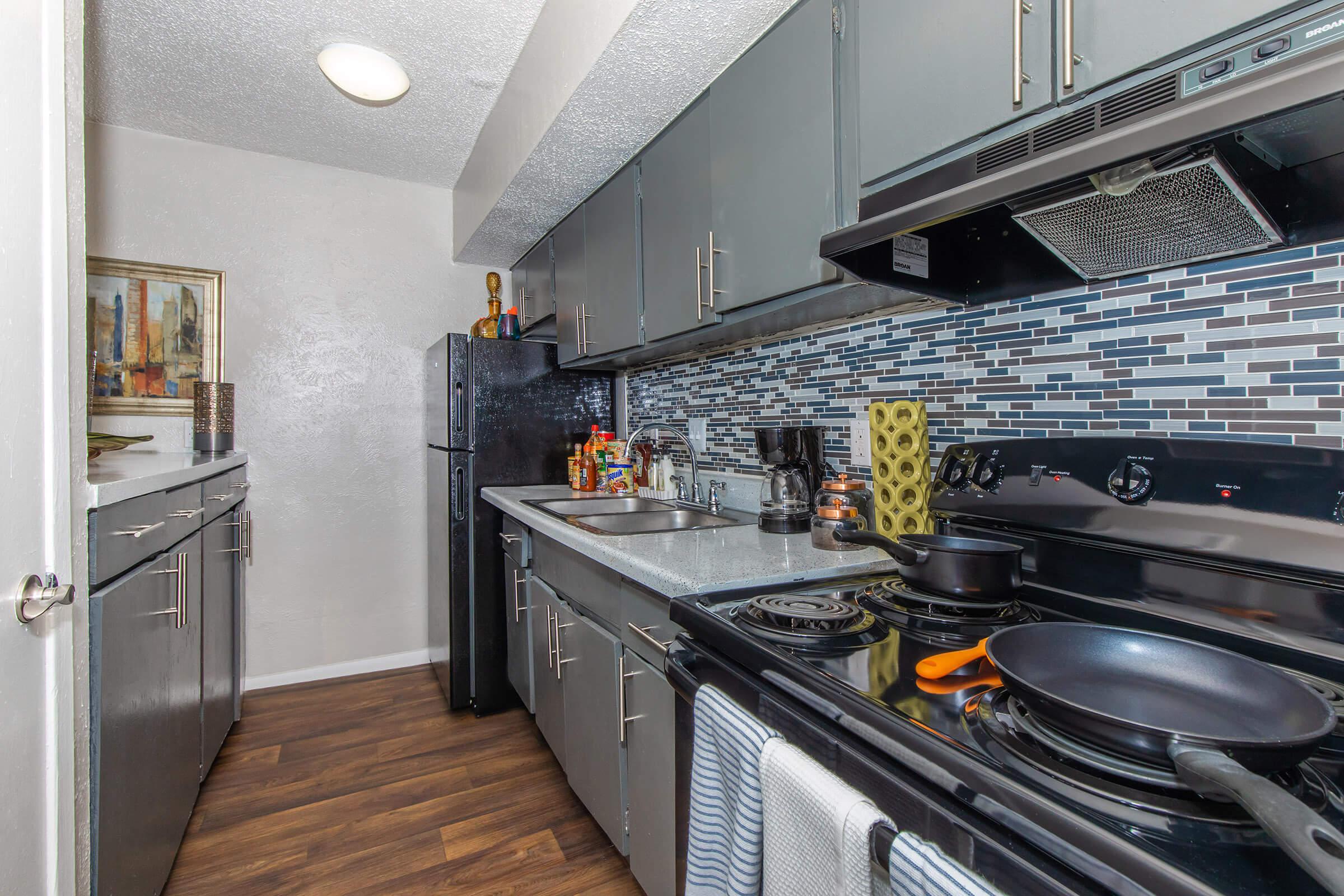 a large kitchen with stainless steel appliances