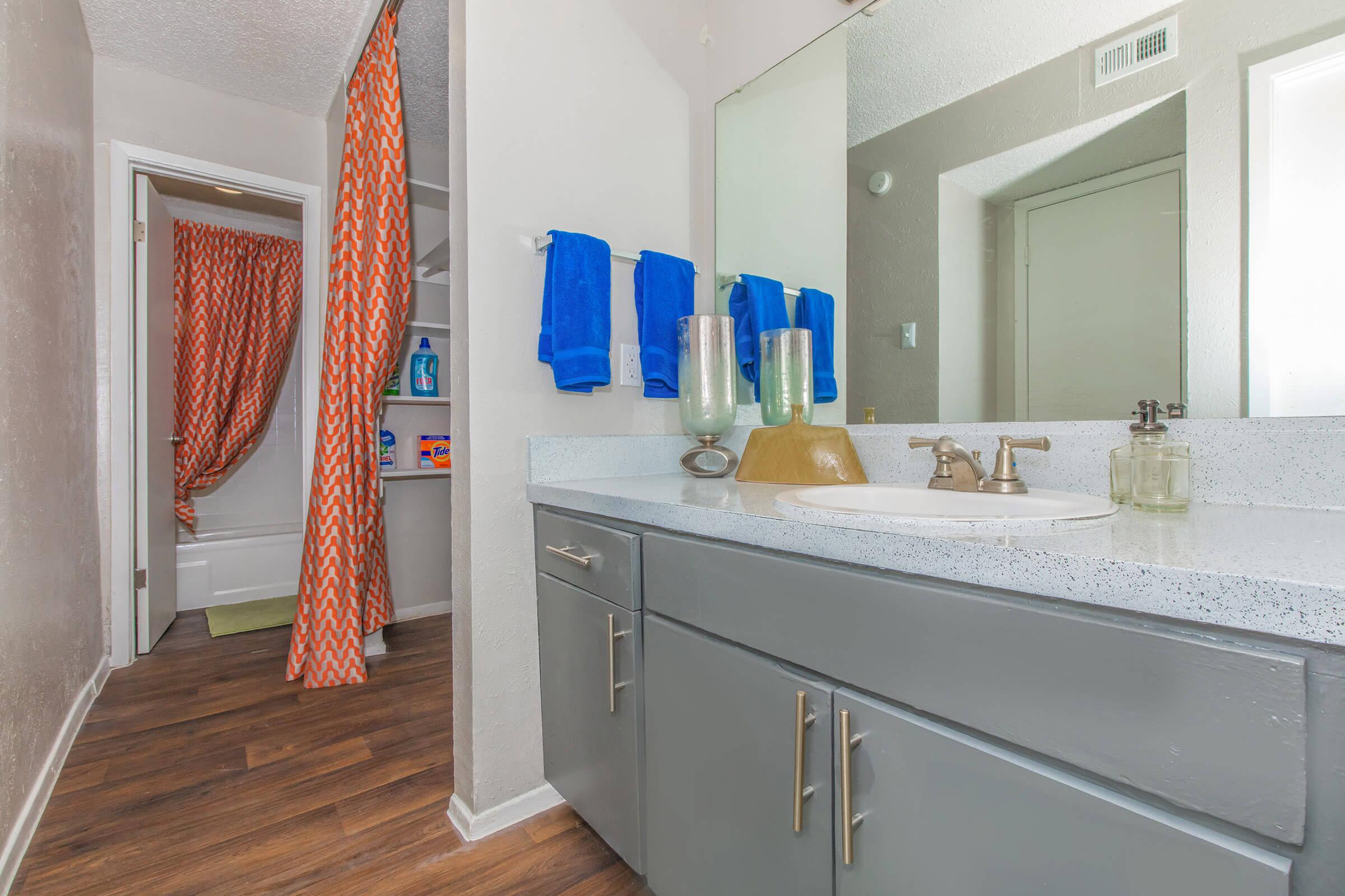 a kitchen with a sink and a mirror