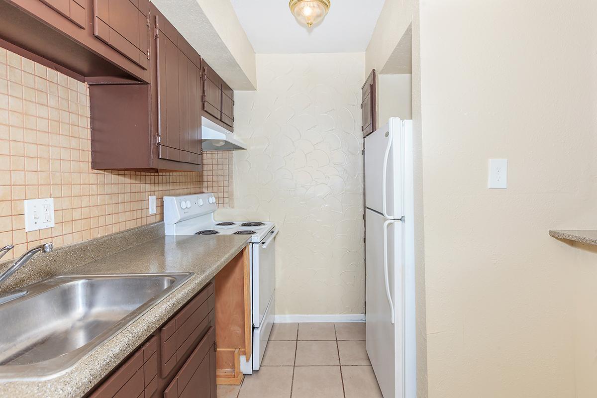 a kitchen with a stove and a sink