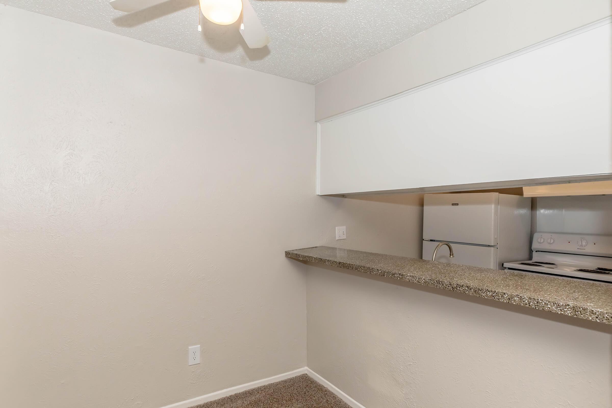 a kitchen with a sink and a mirror