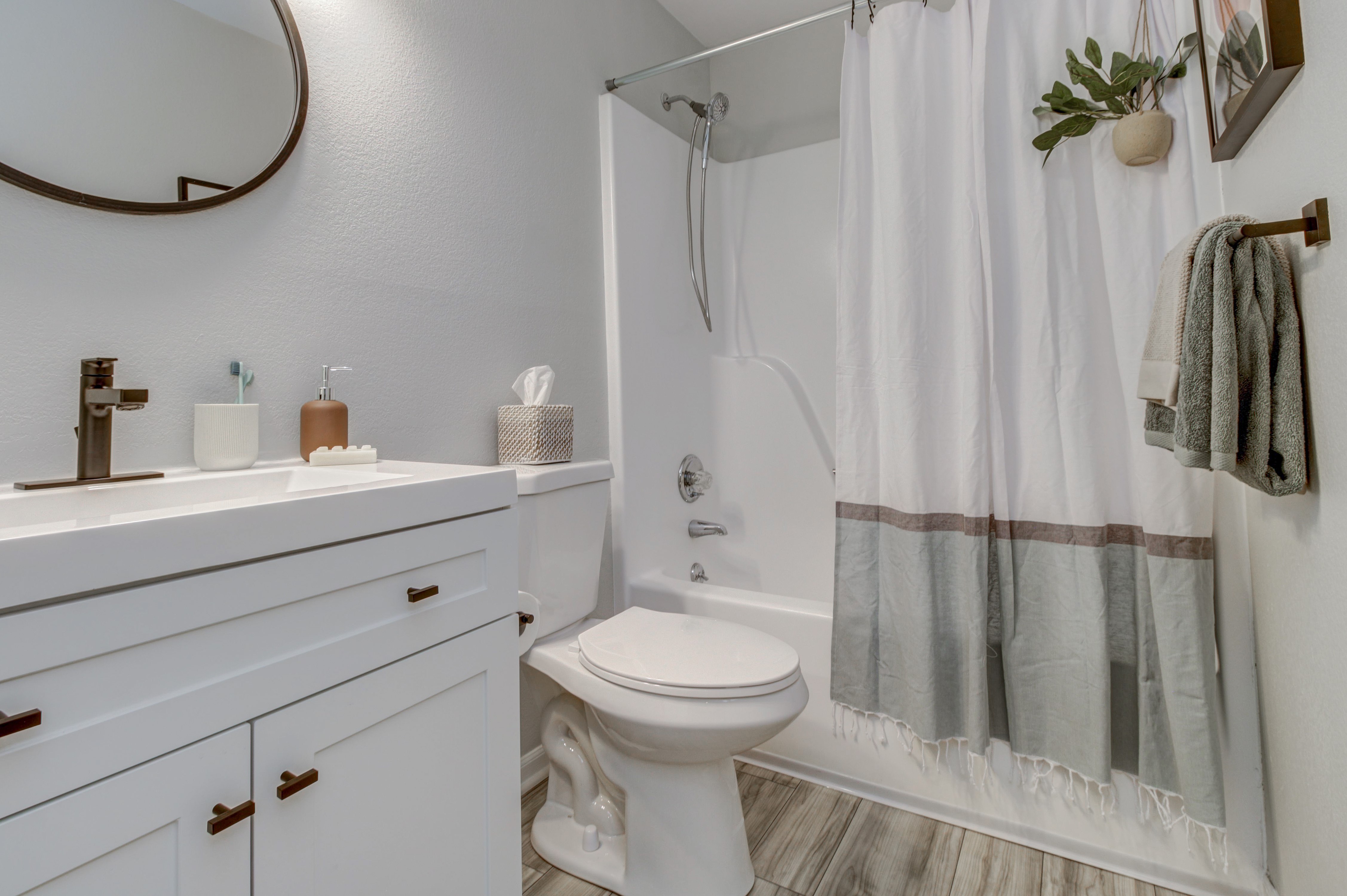 Updated Bathroom with Bathtub - Sunnyside Garden Apartments - Blue Springs - Missouri