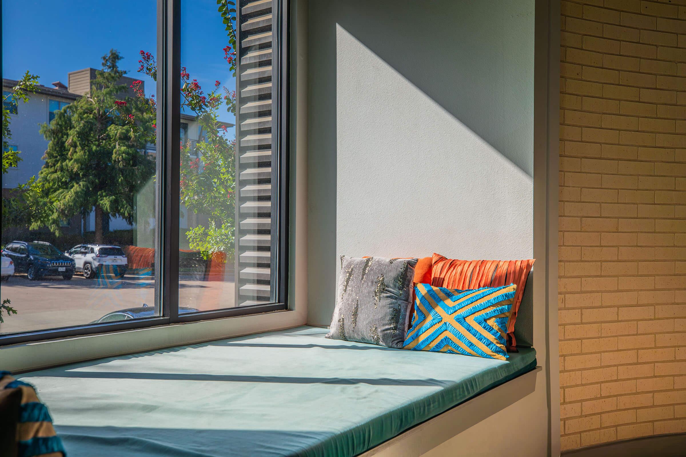 a bedroom with a large window