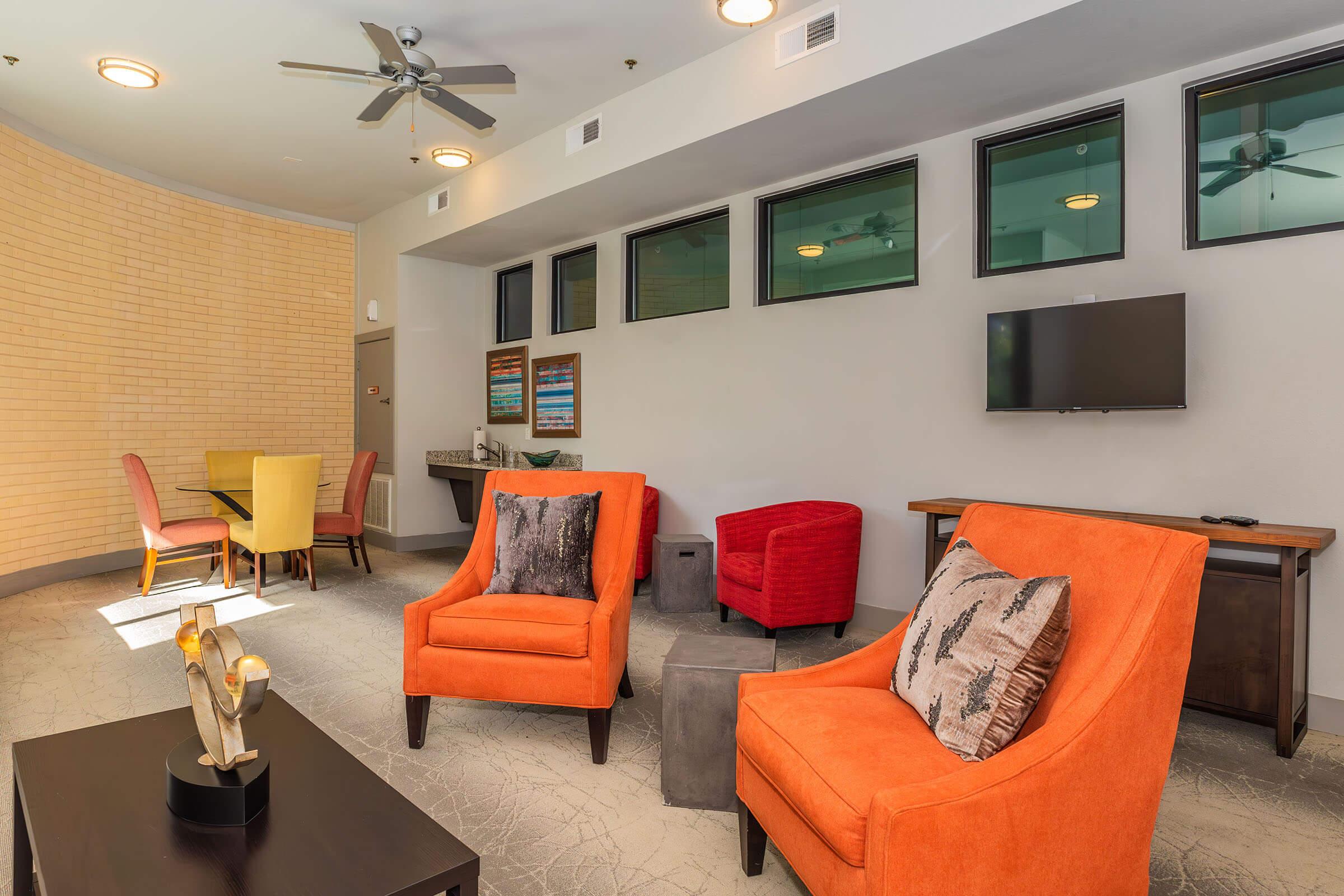 a living room filled with furniture and a rug