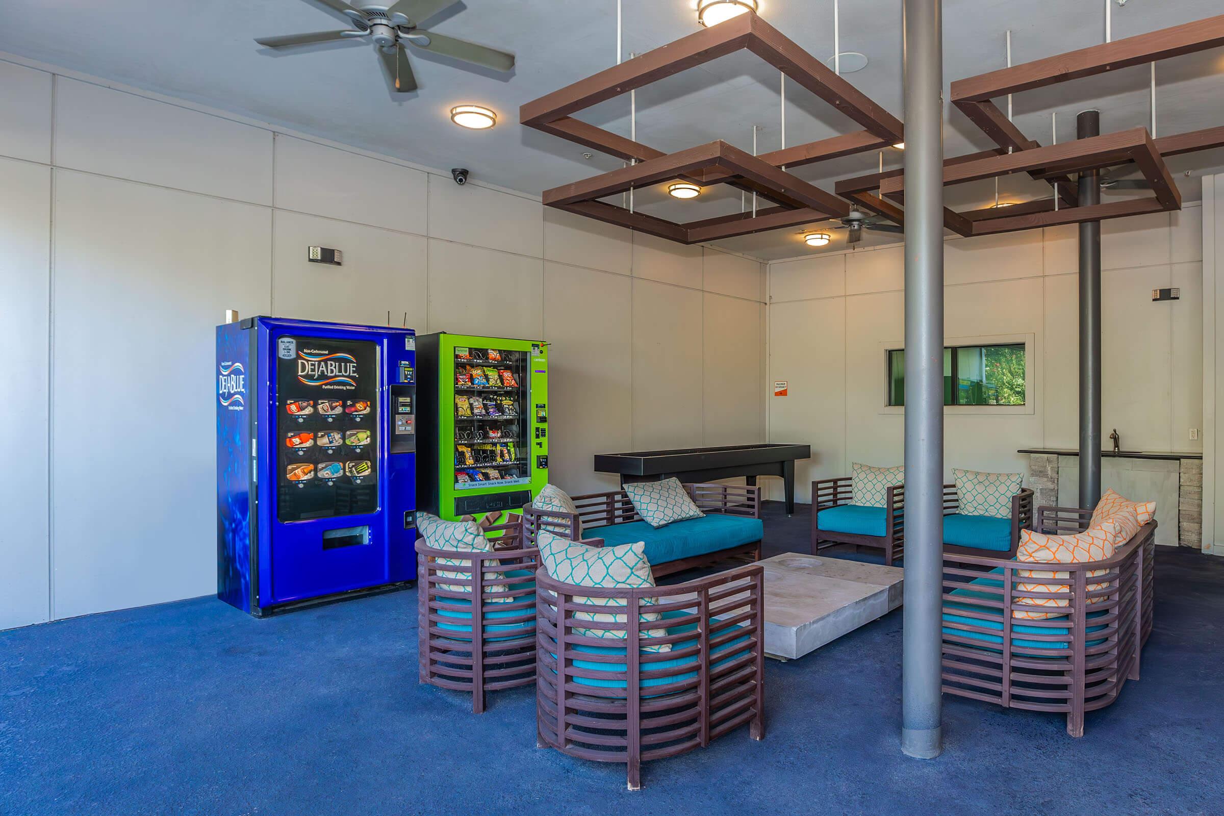 a kitchen with a blue chair