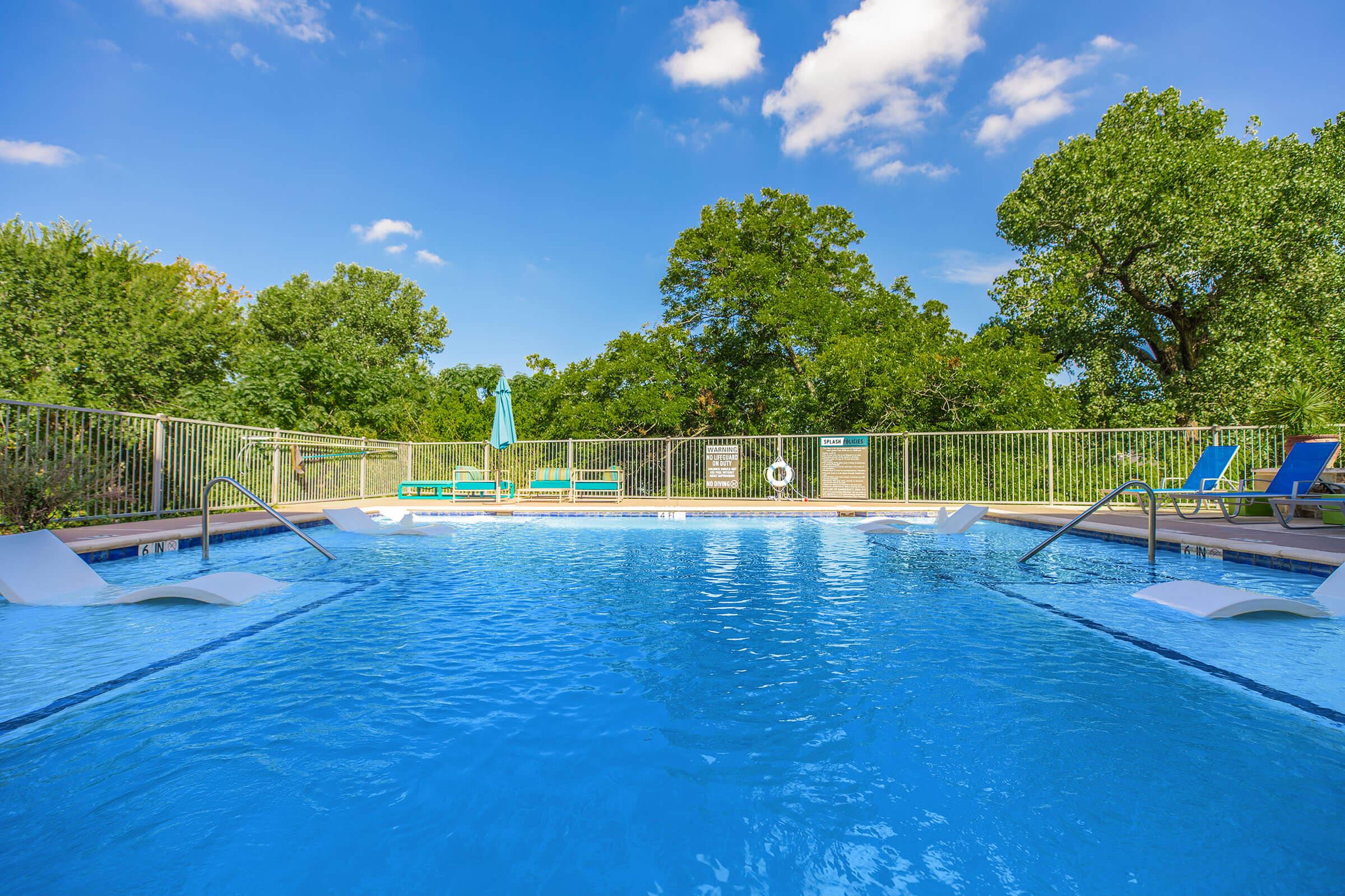 a pool next to a body of water