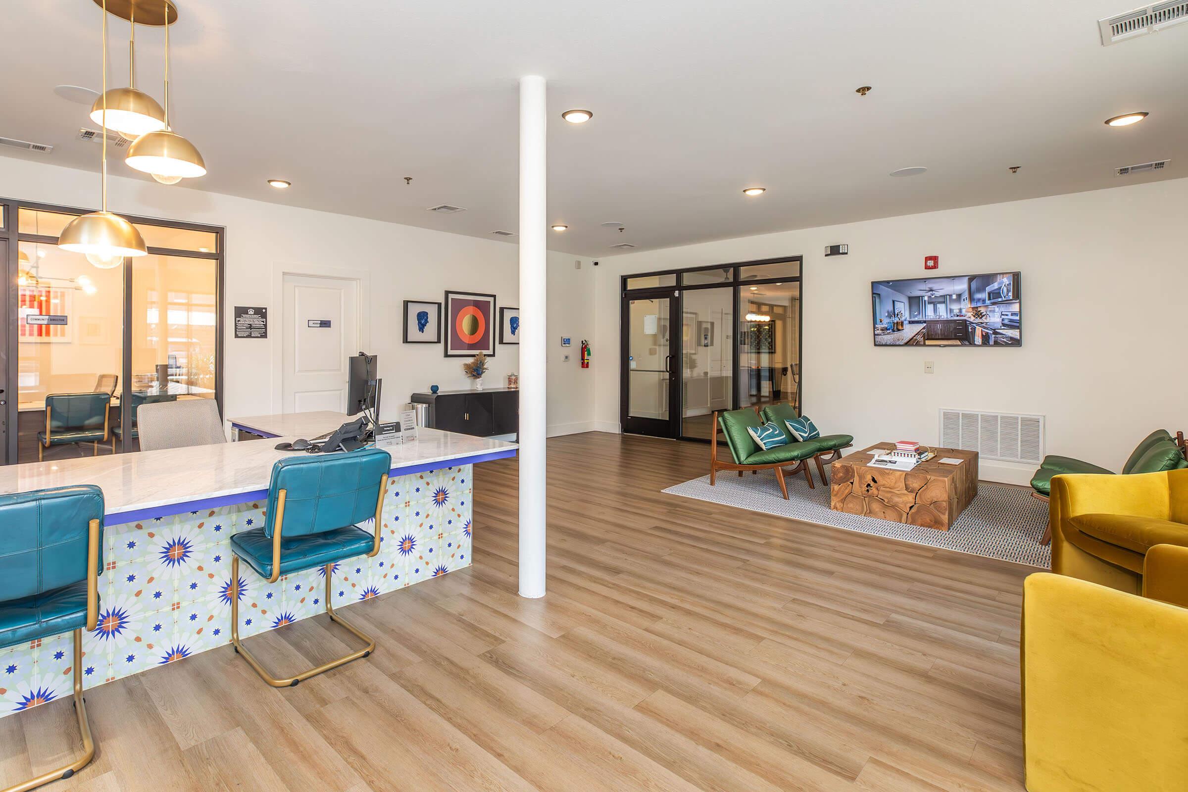 a living room filled with furniture and wood cabinets