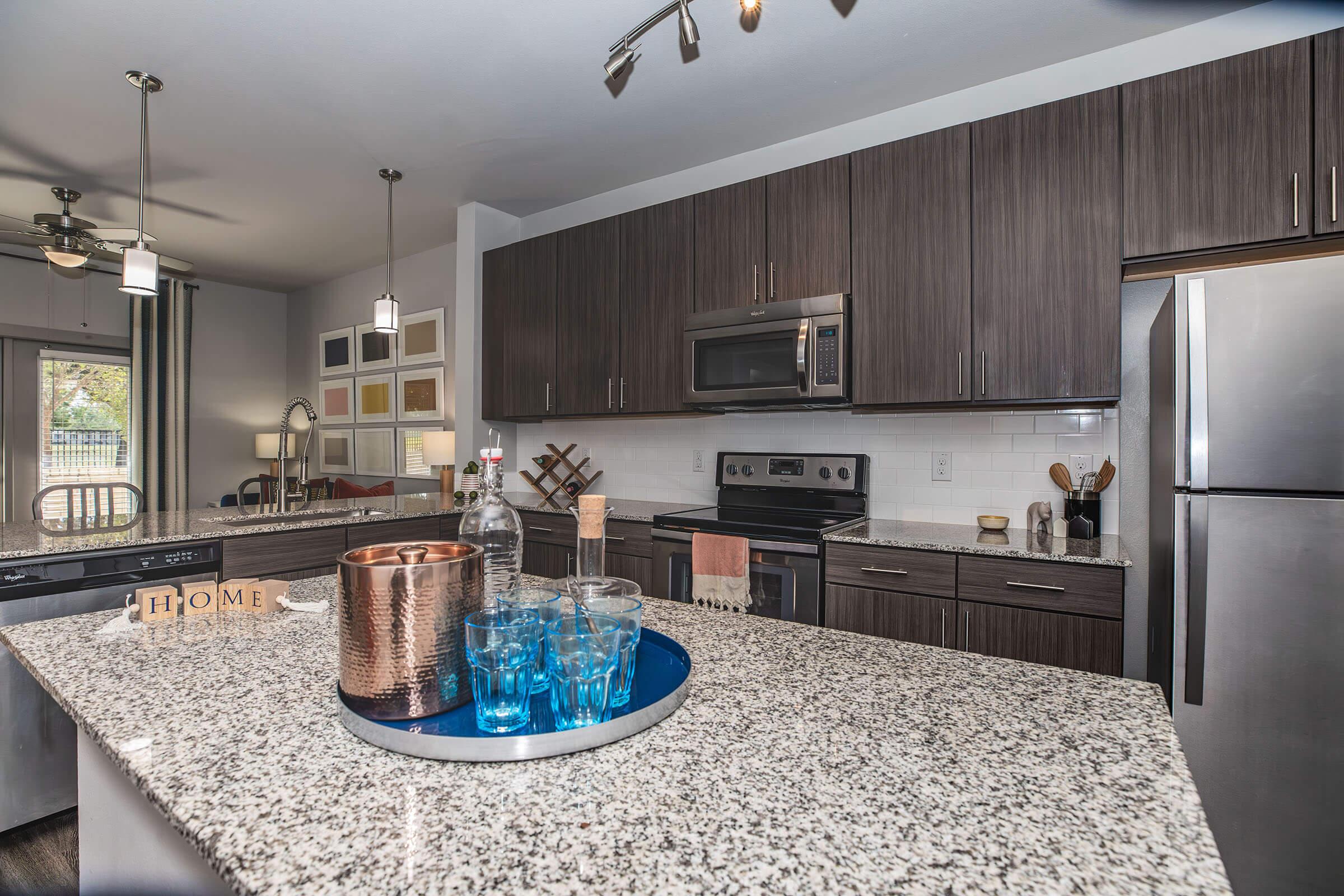 a kitchen with an island in the middle of a room