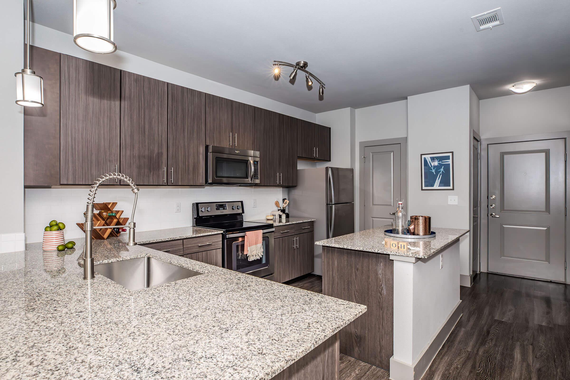 a modern kitchen with stainless steel appliances