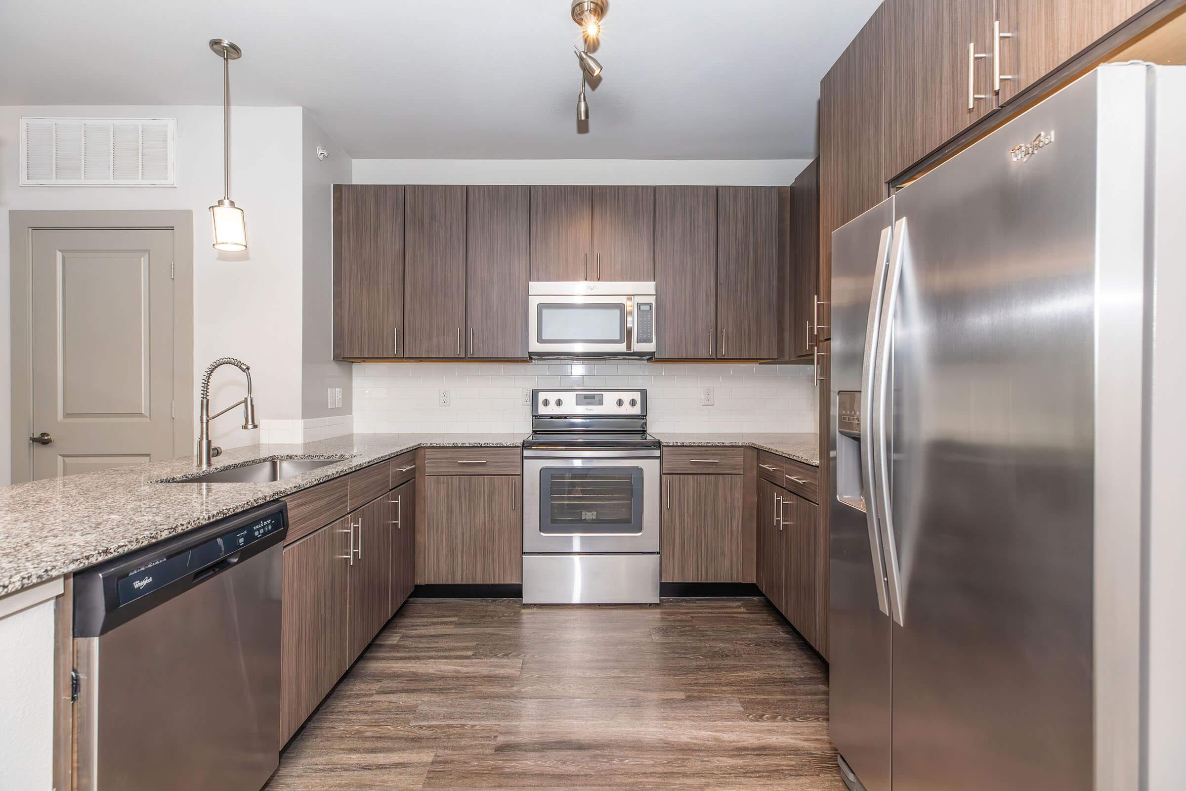 a modern kitchen with stainless steel appliances