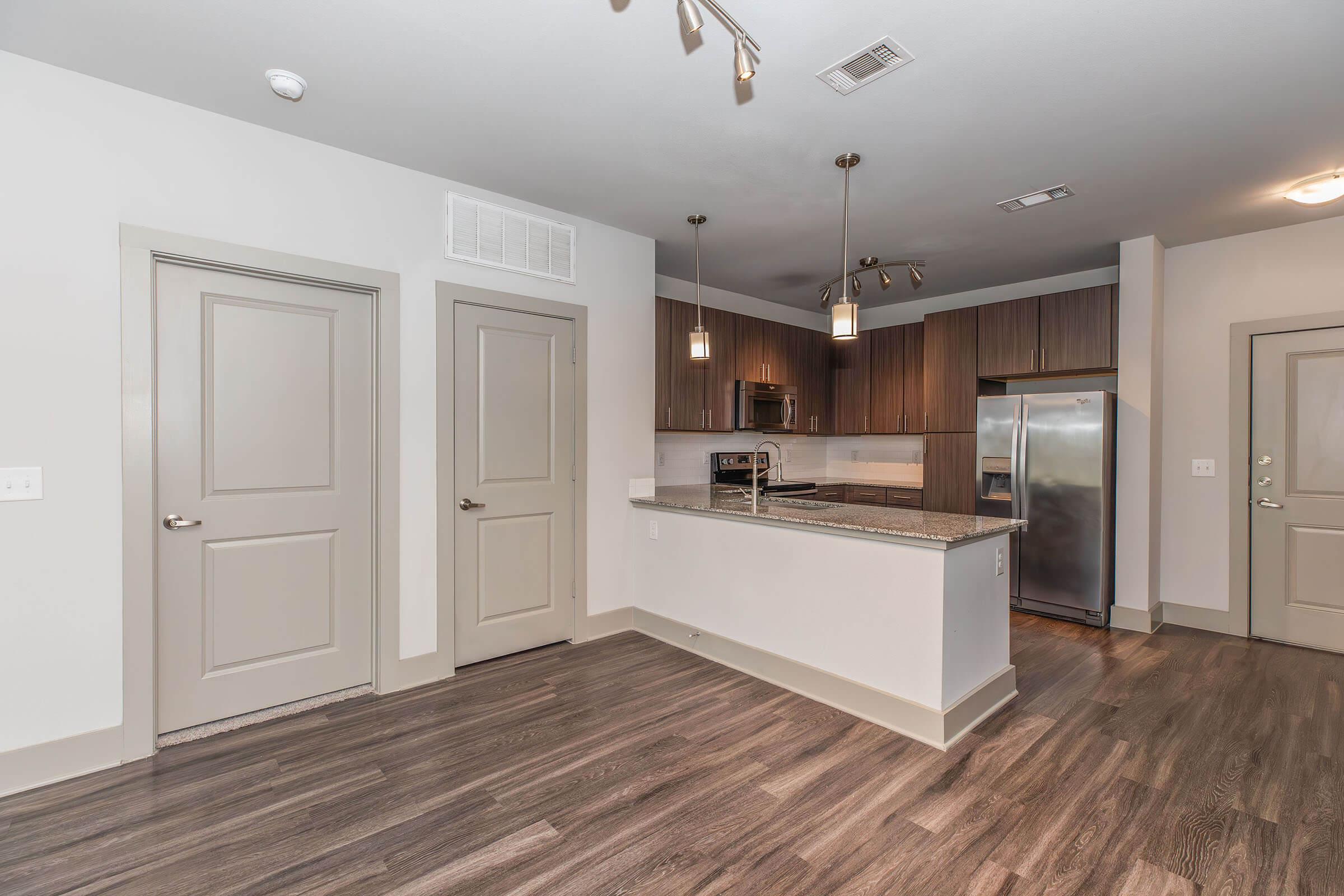 a kitchen with a building in the background