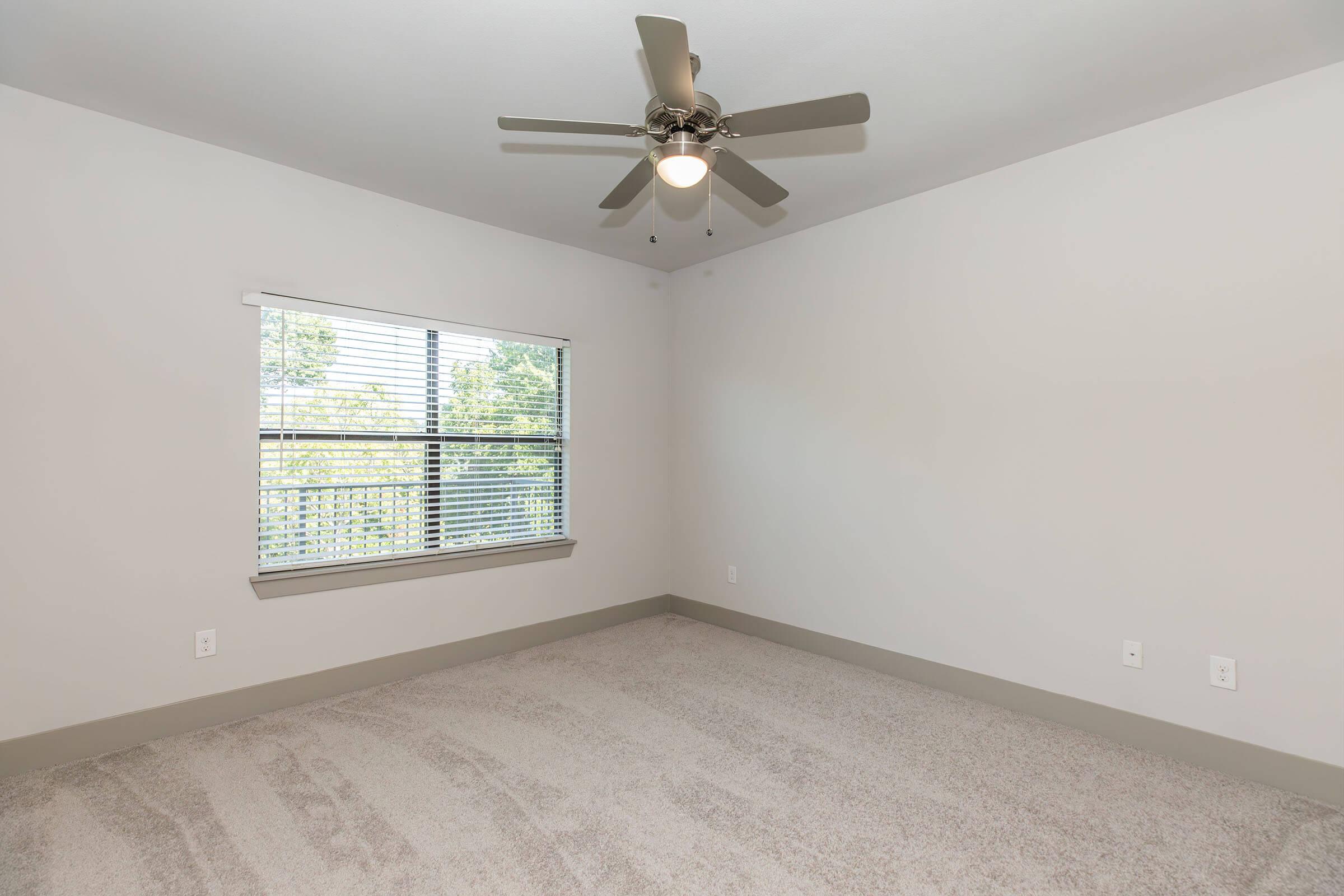 a bedroom with a large window