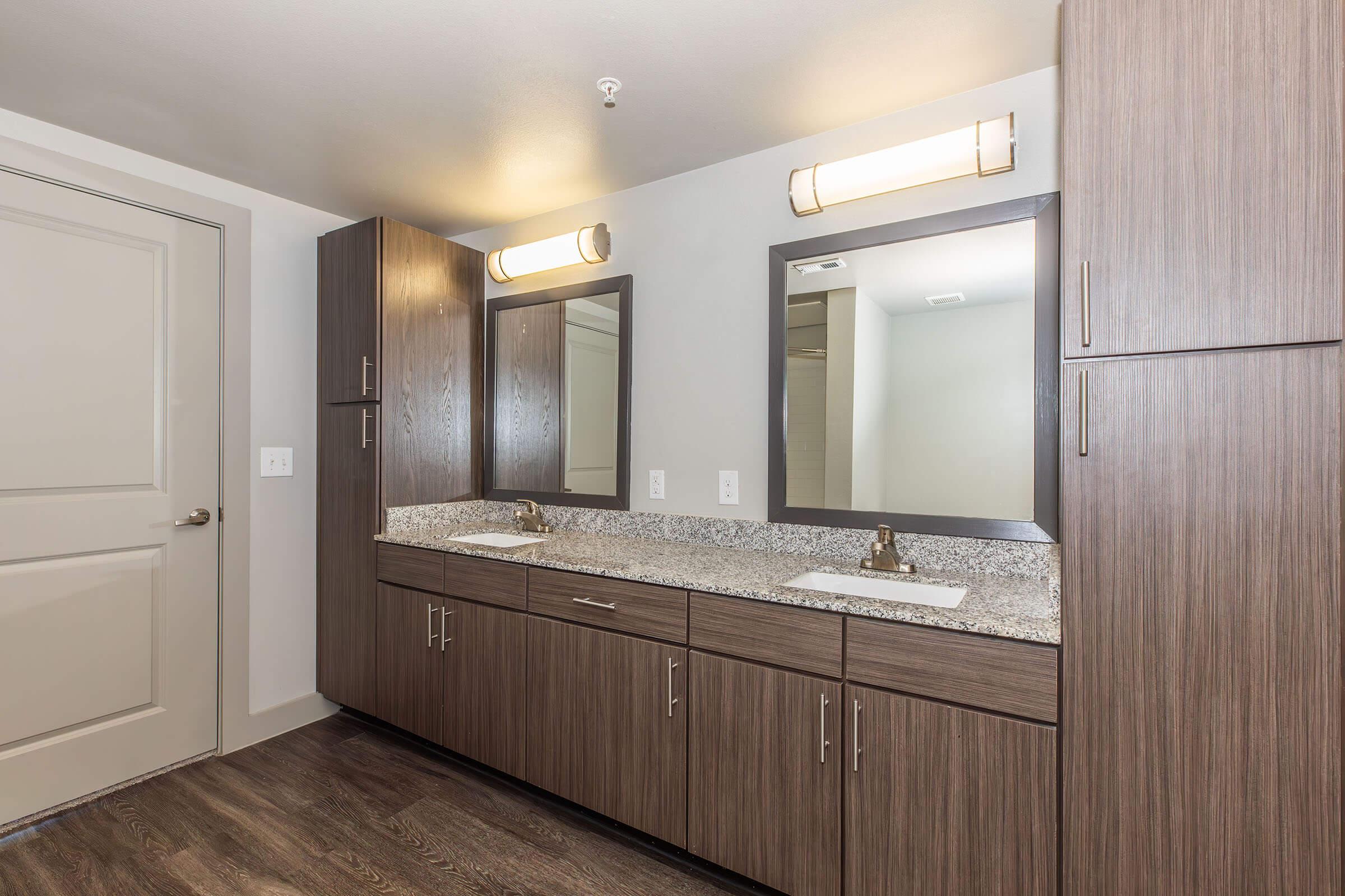 a kitchen with a sink and a mirror