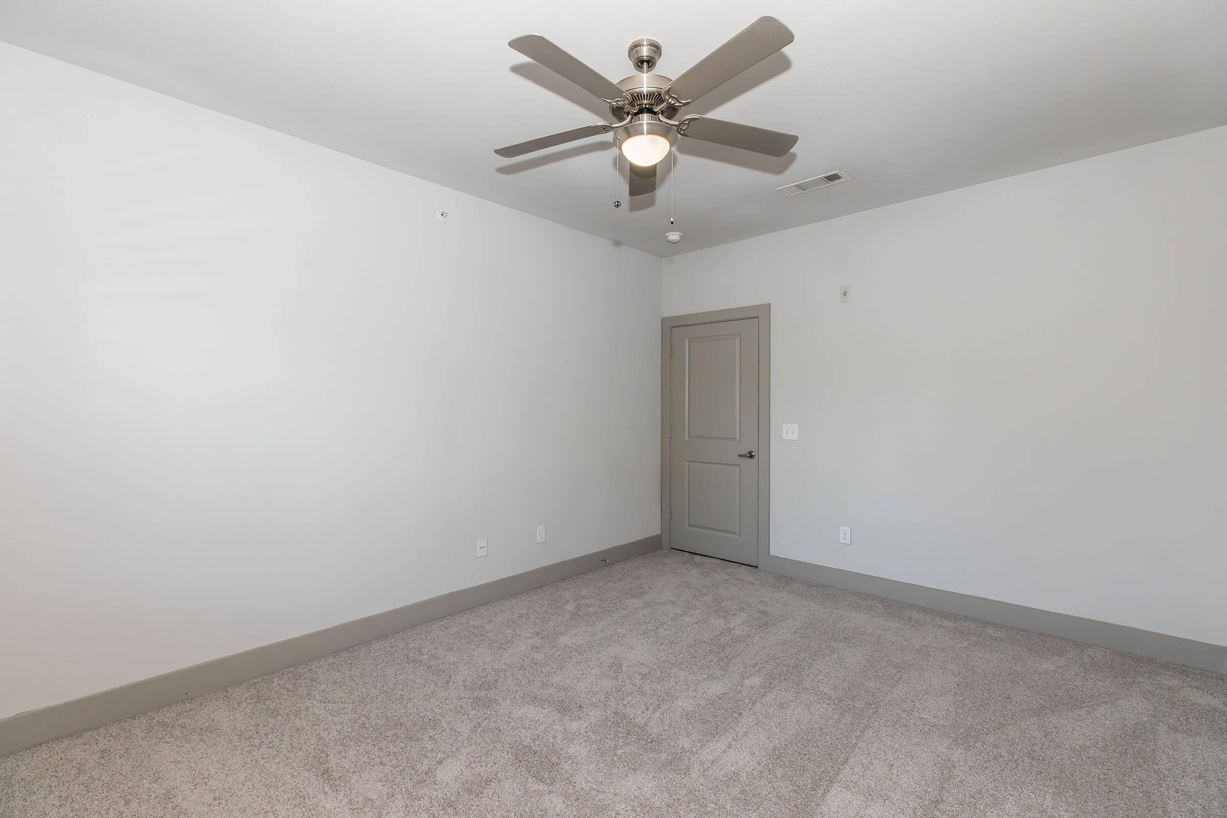 a bedroom with a large mirror