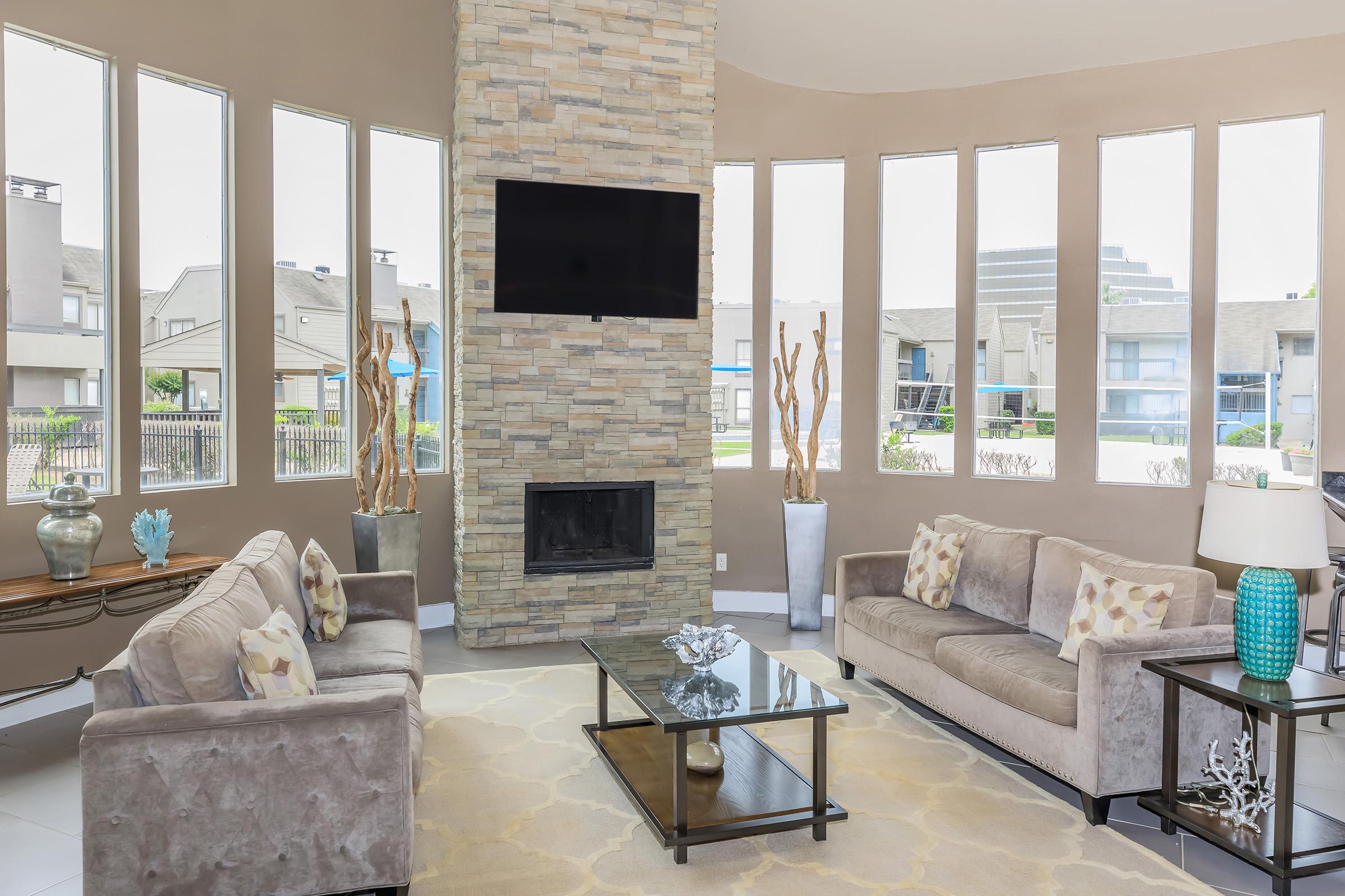 a living room filled with furniture and a fire place