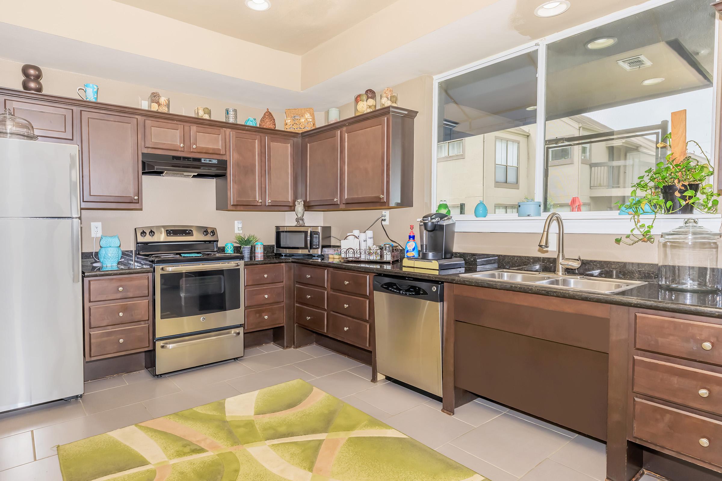 a modern kitchen with stainless steel appliances