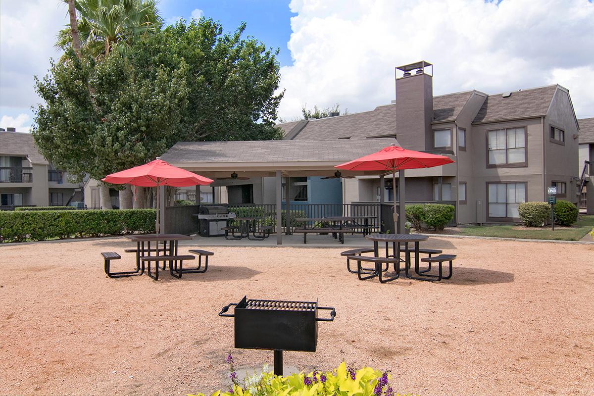 a group of lawn chairs sitting on top of a picnic table