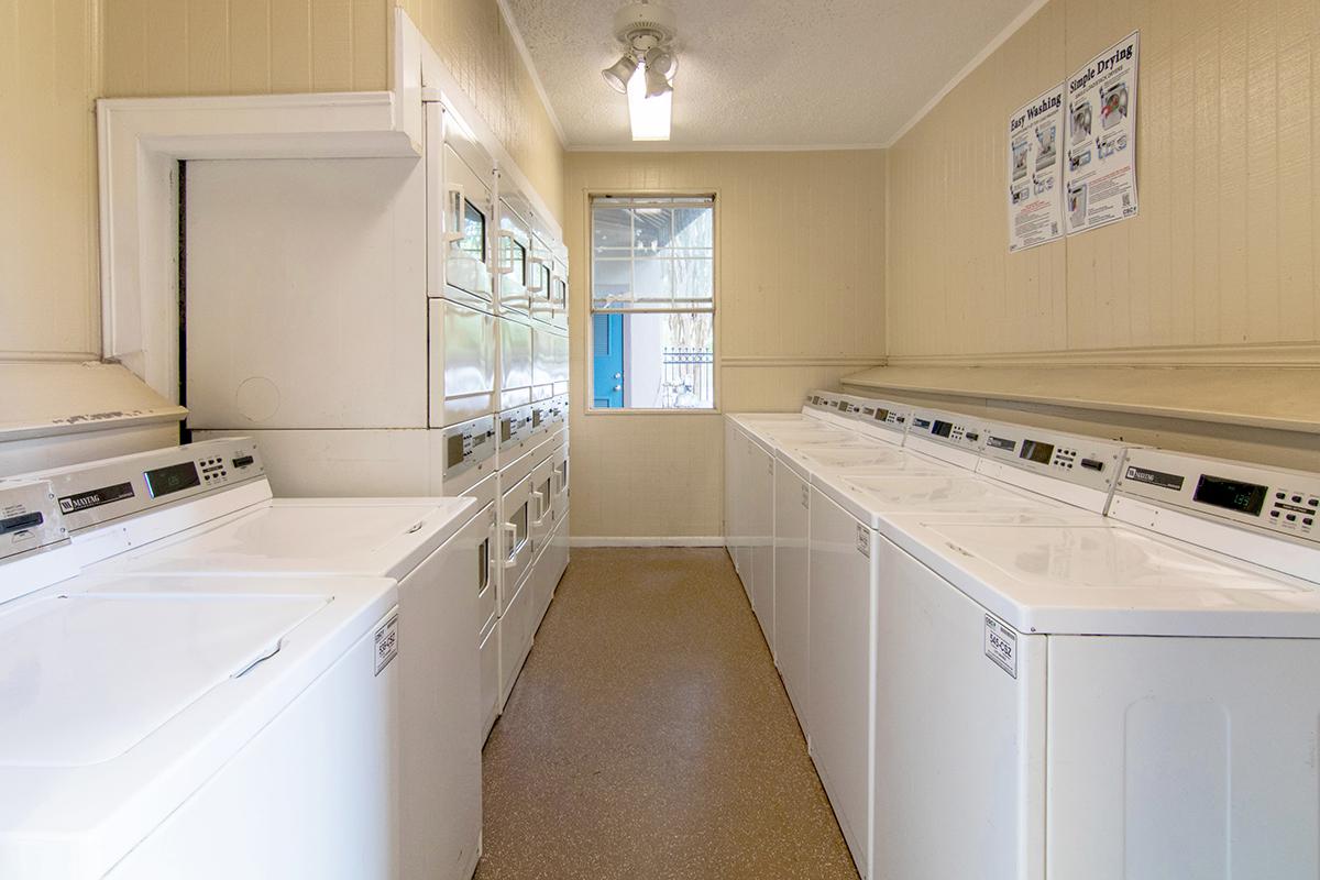 a white stove top oven sitting inside of a kitchen