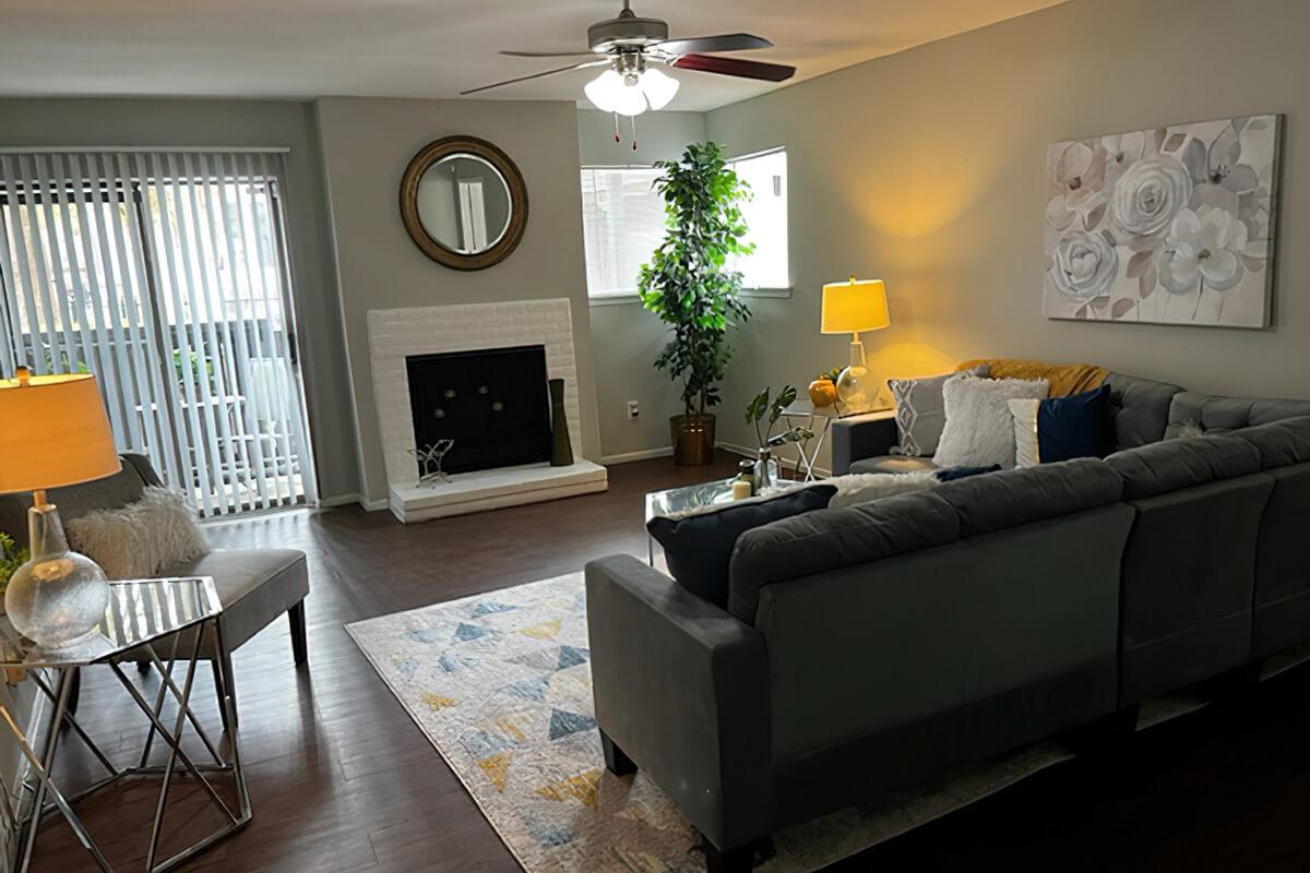 a living room filled with furniture and a fire place