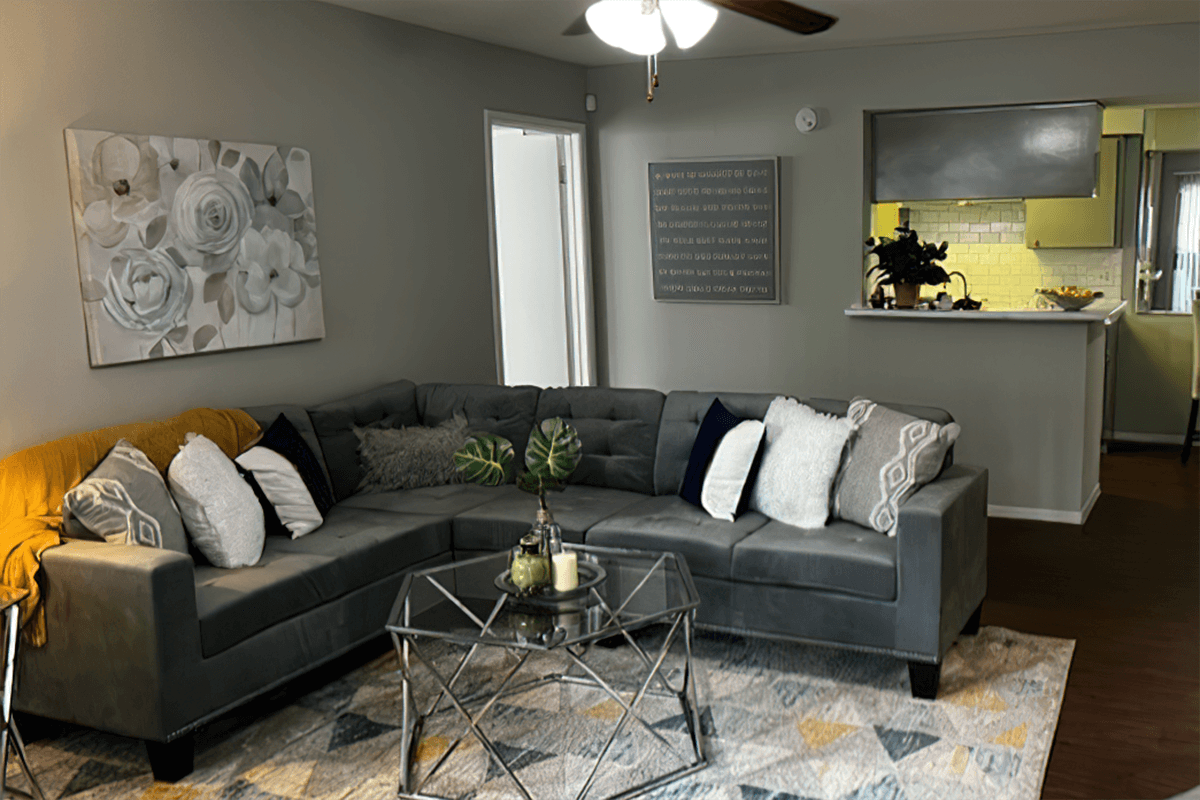 a living room filled with furniture and a fireplace