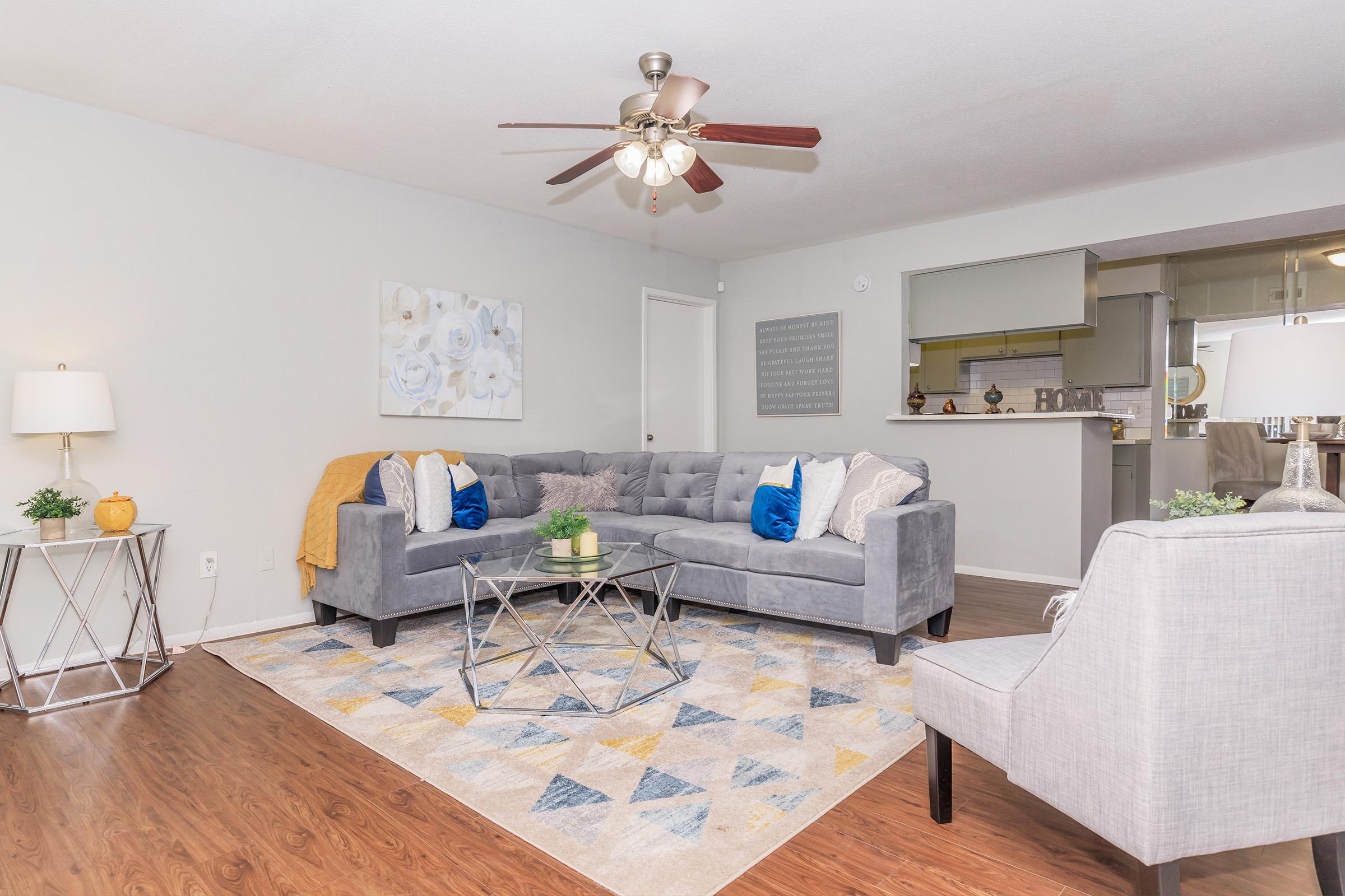 a living room filled with furniture and a rug