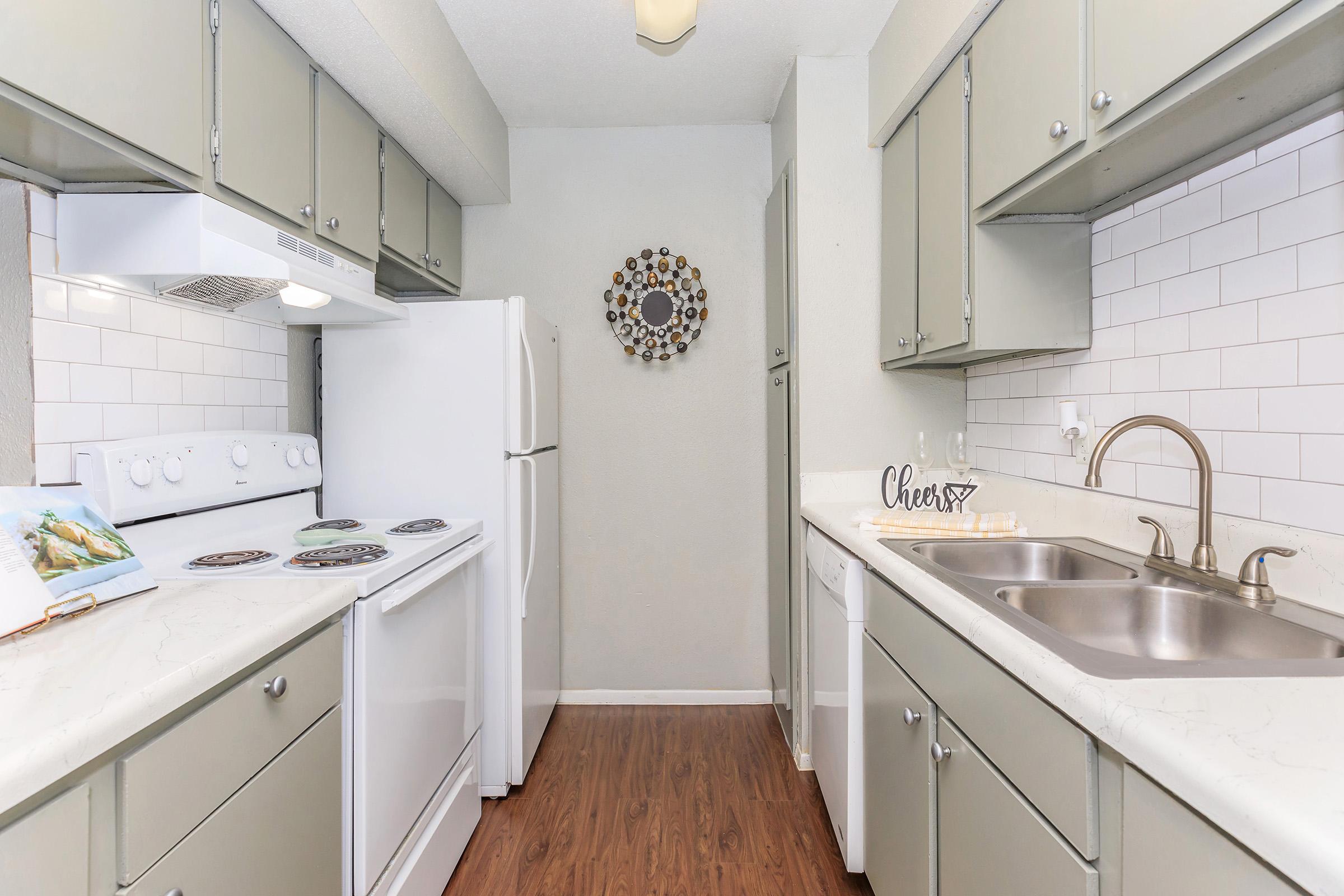 a kitchen with a stove and a sink