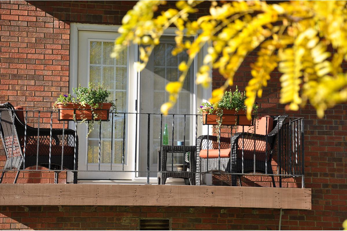 a bench in front of a brick building