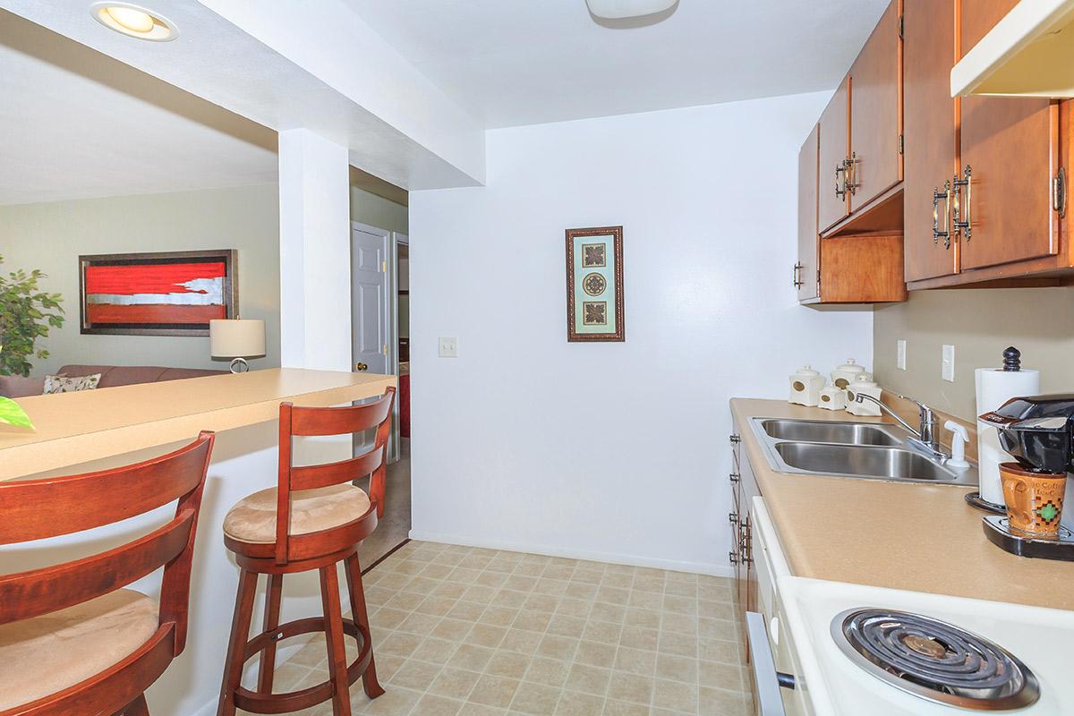 a kitchen with an island in the middle of a room