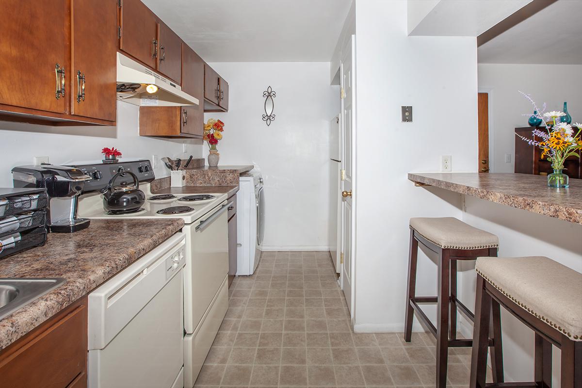 a kitchen with a stove and a sink