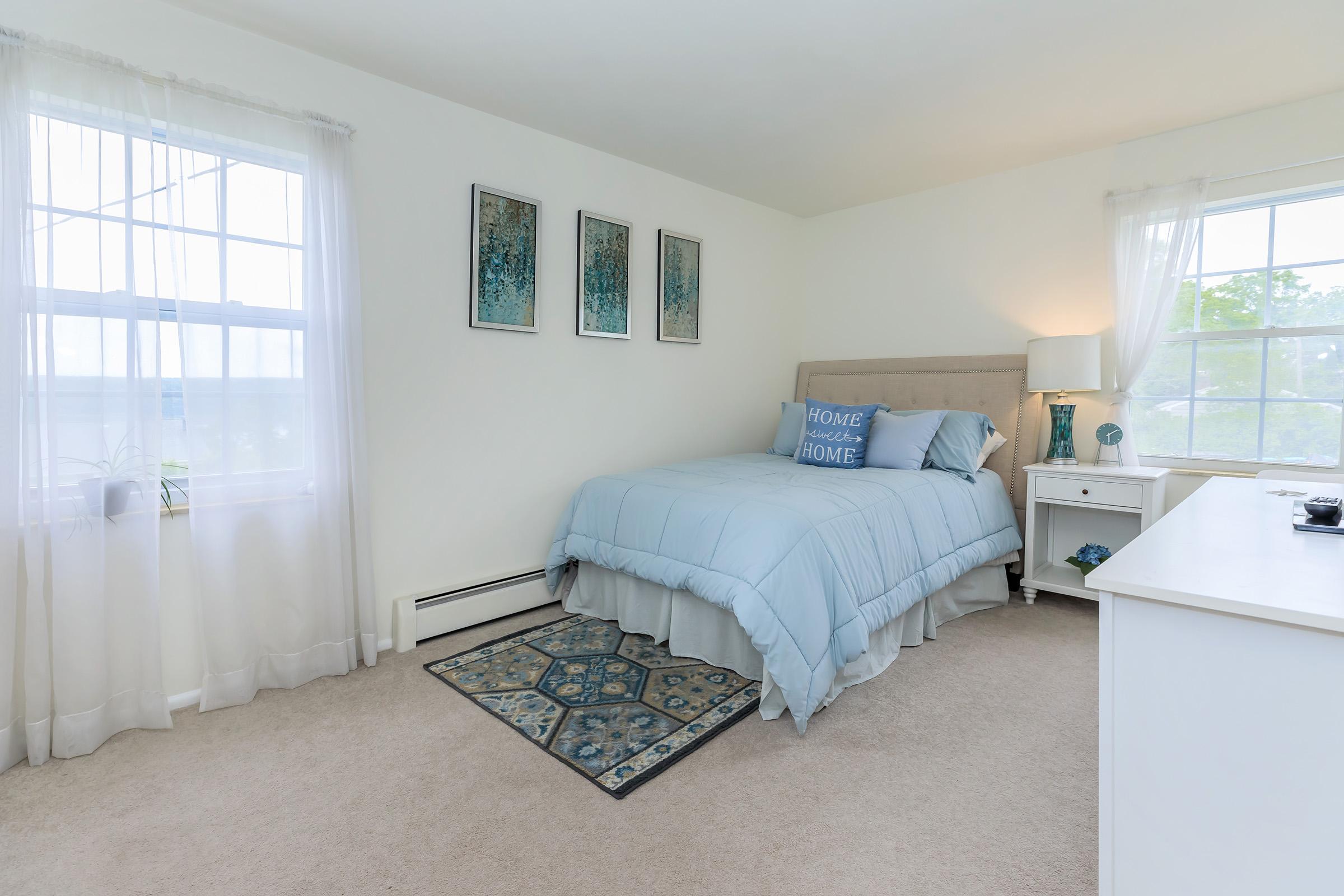 a bedroom with a bed and window in a room