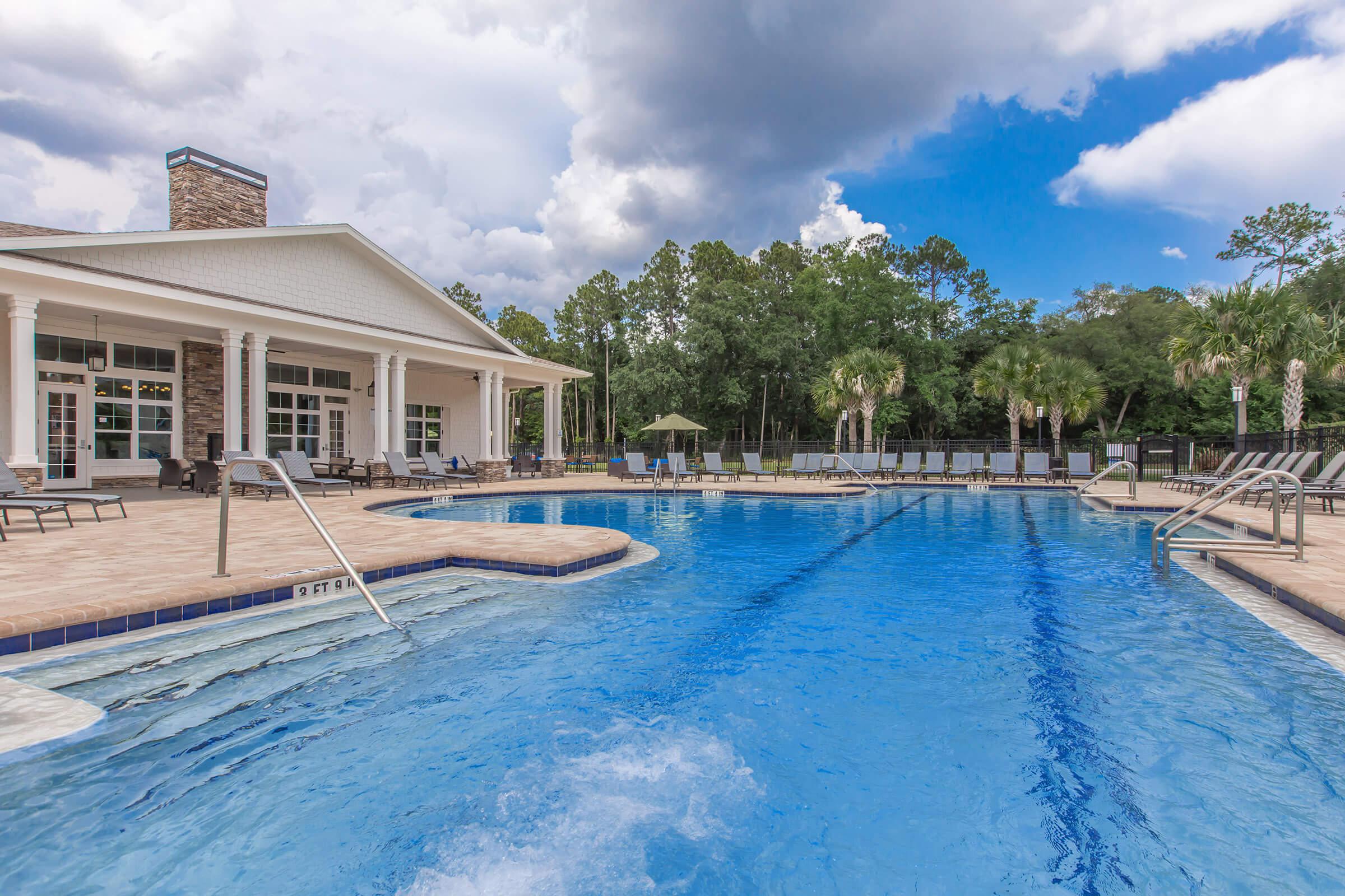 a pool next to a body of water