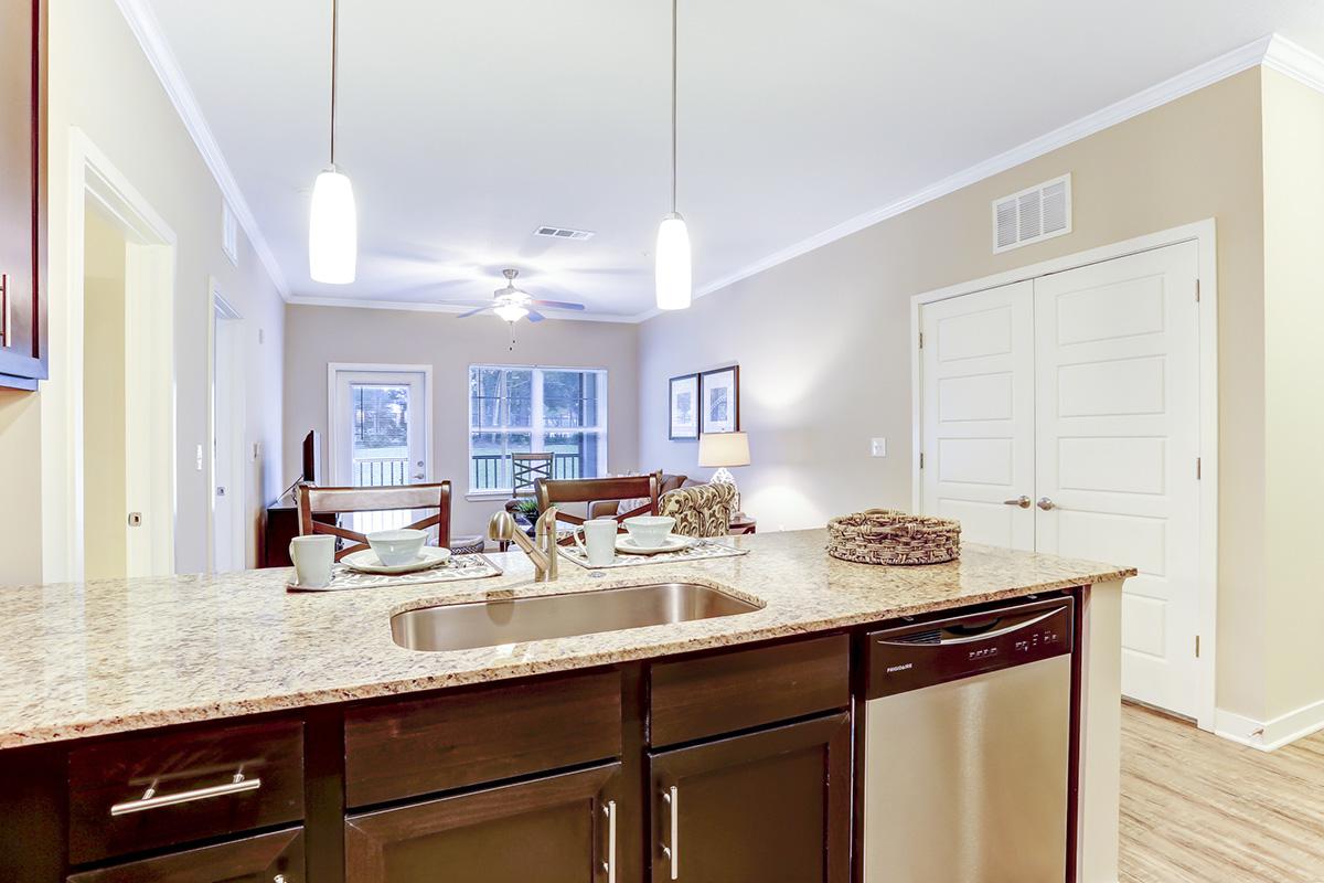 a kitchen with a sink and a window