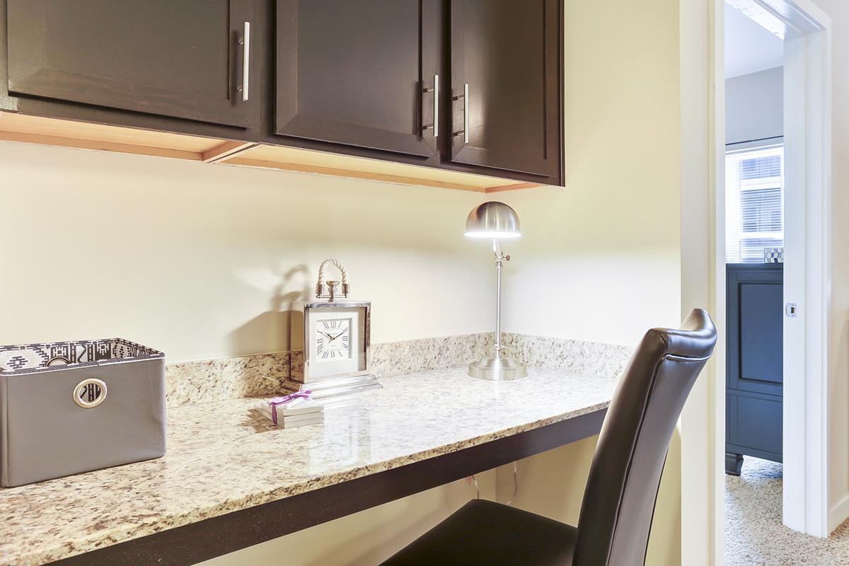 a kitchen with a sink and a mirror