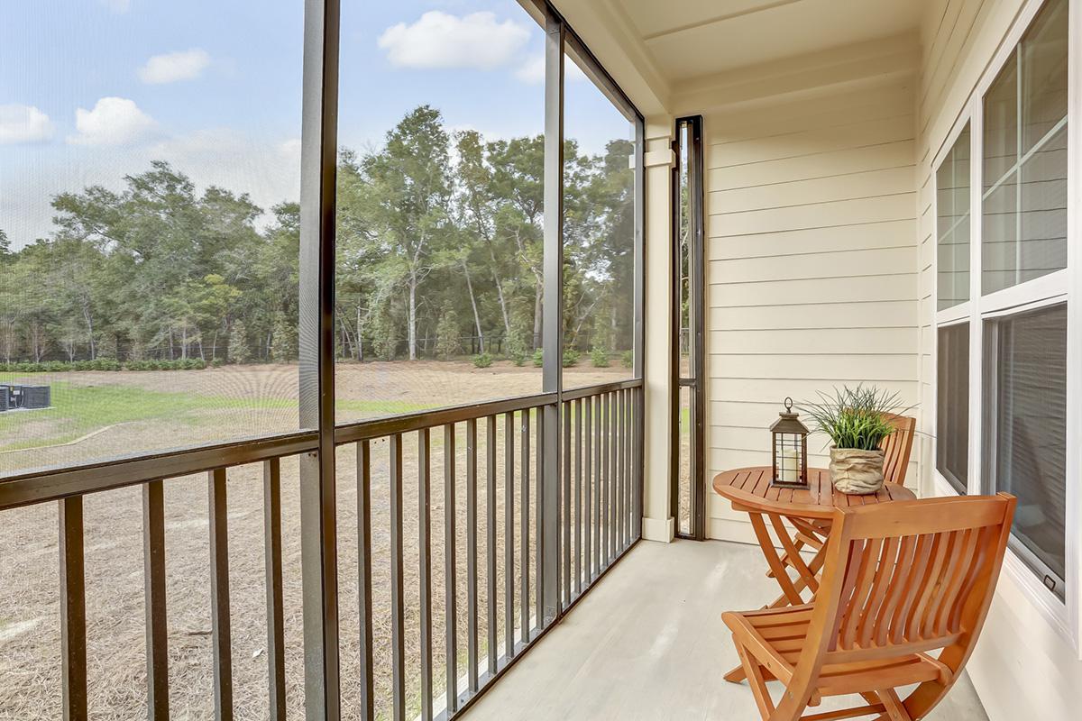 a dining room table in front of a fence