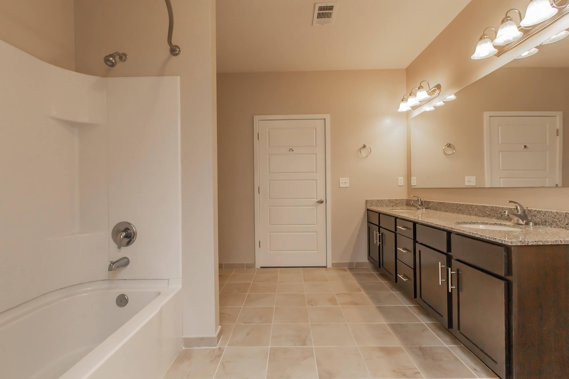 a kitchen with a sink and a mirror