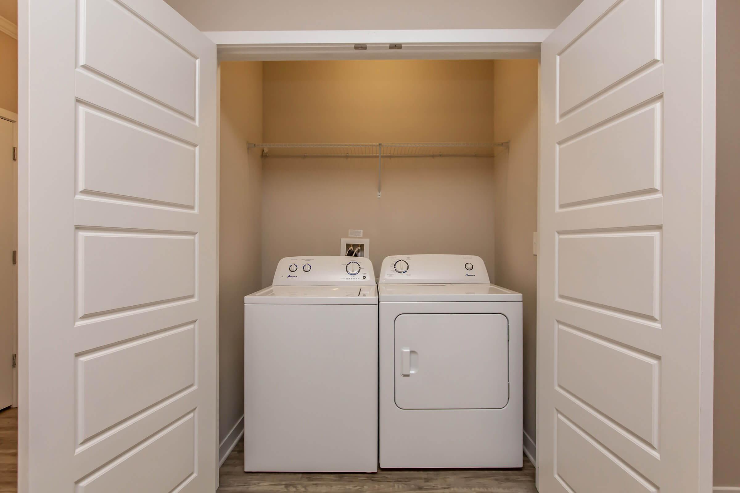 a white refrigerator freezer sitting inside of a kitchen