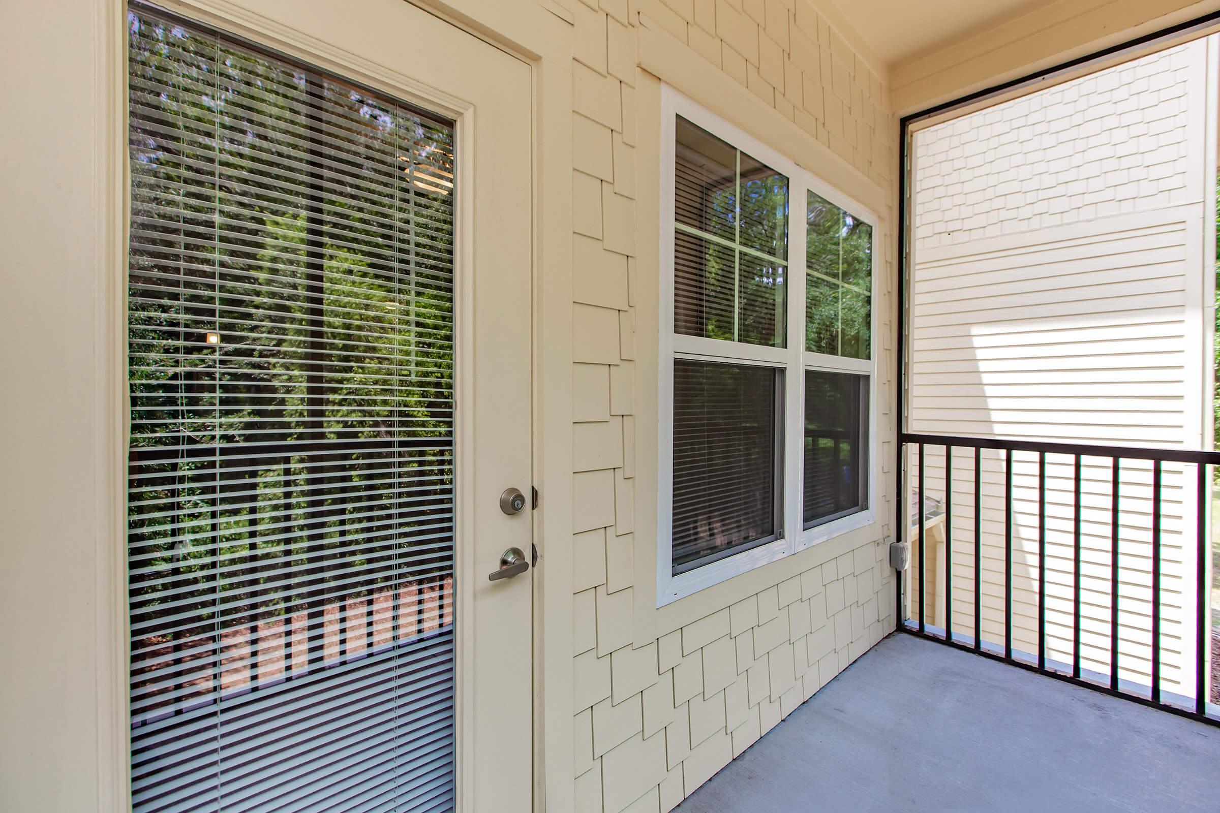 a glass door with a window in a brick room