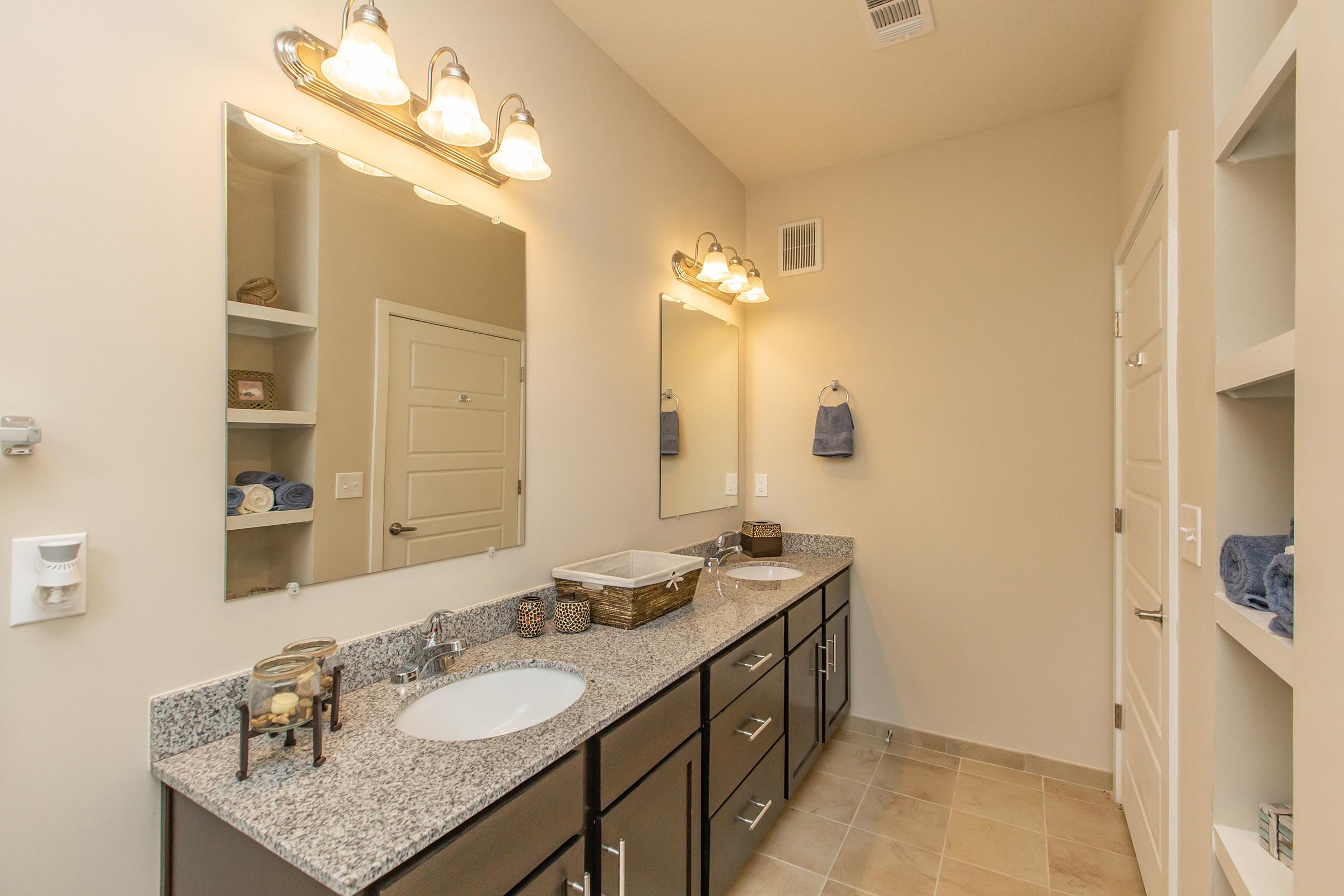 a kitchen with a sink and a mirror