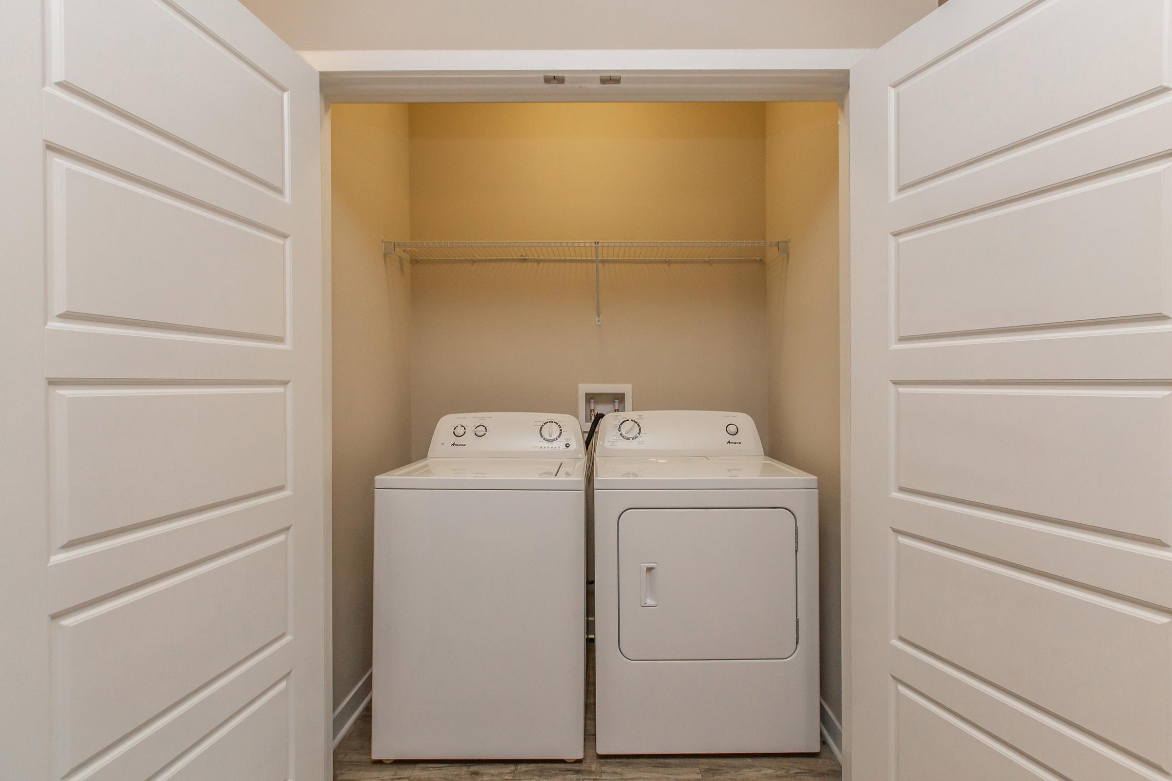 a white refrigerator freezer sitting inside of a kitchen