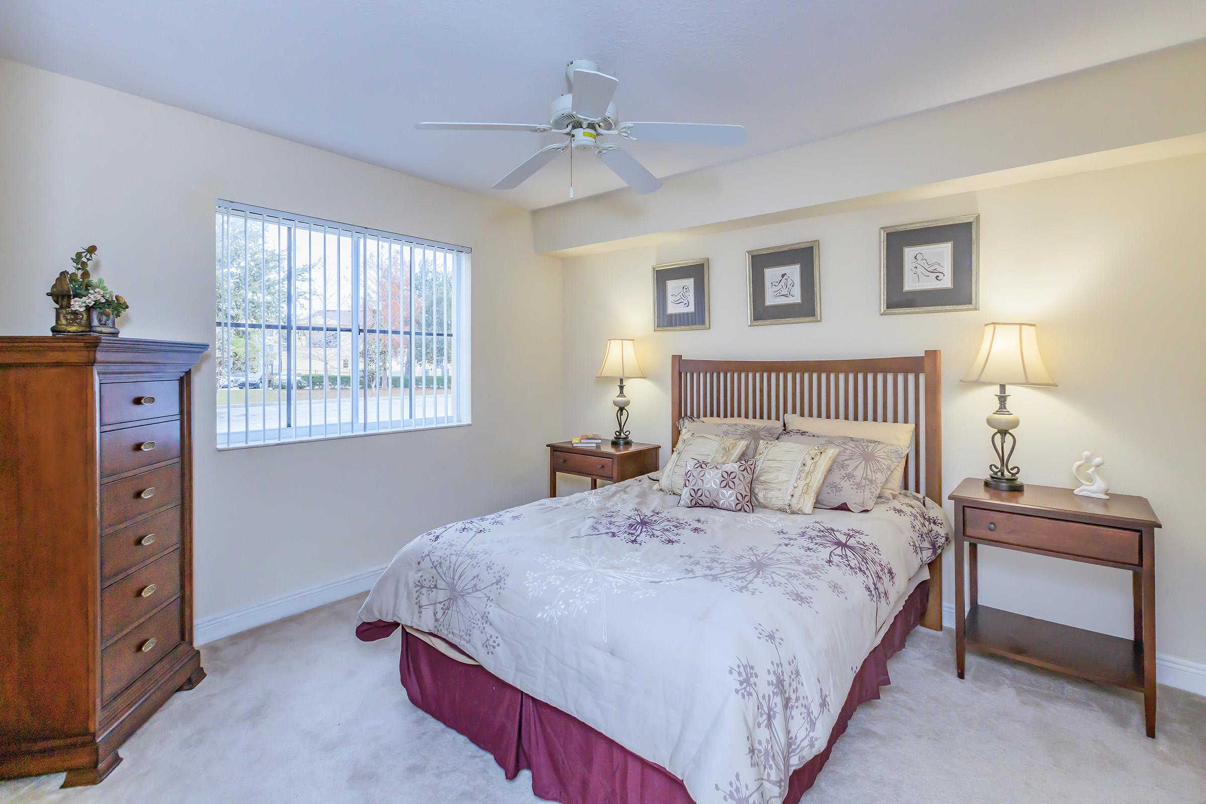 a bedroom with a large bed in a room