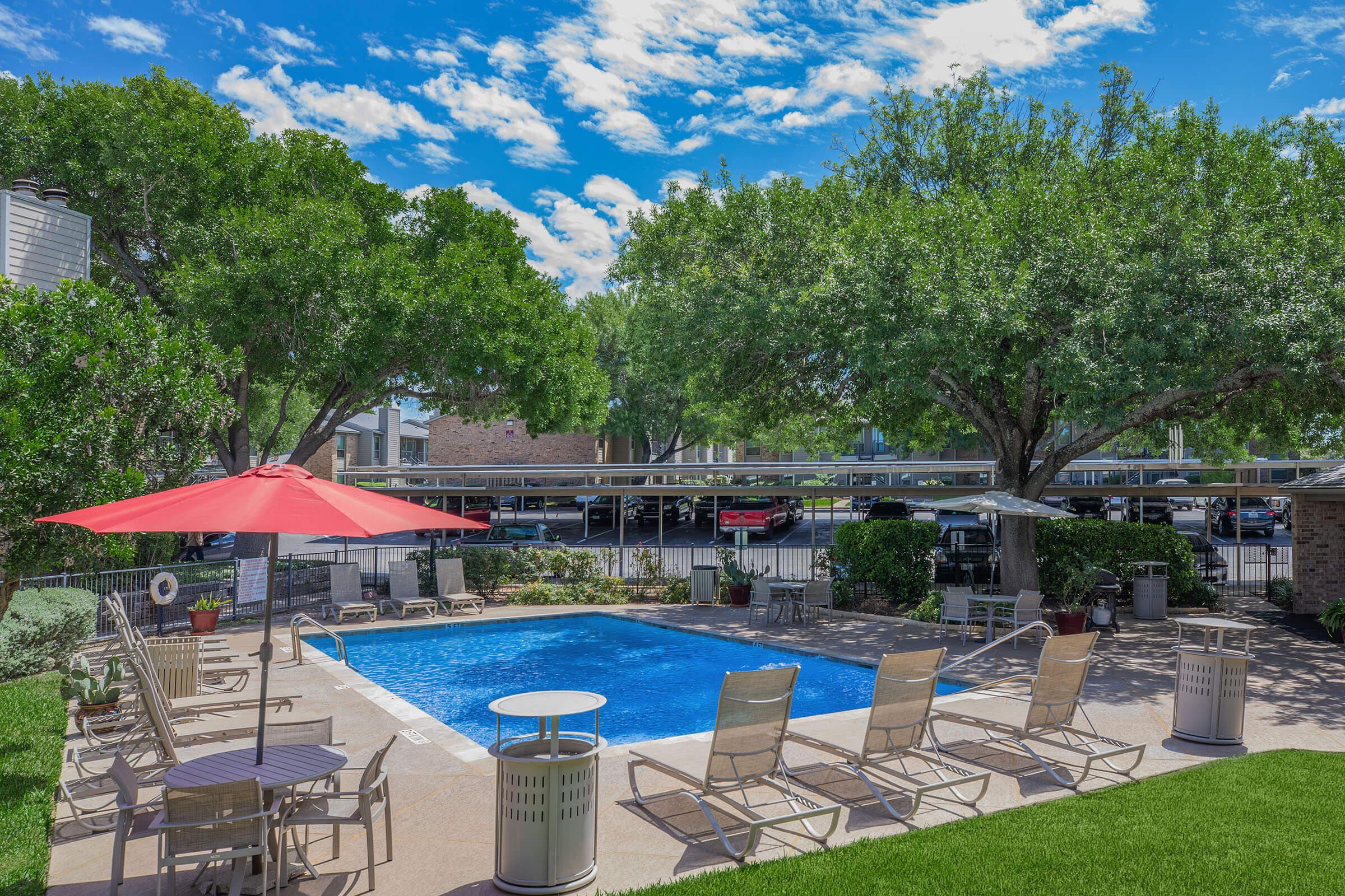 a pool next to an umbrella