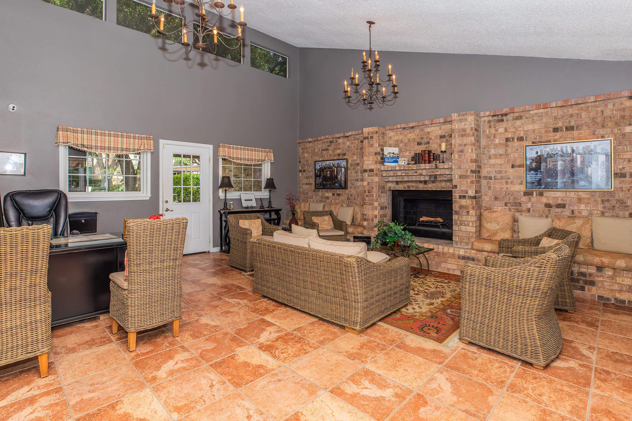 a living room filled with furniture and a fireplace