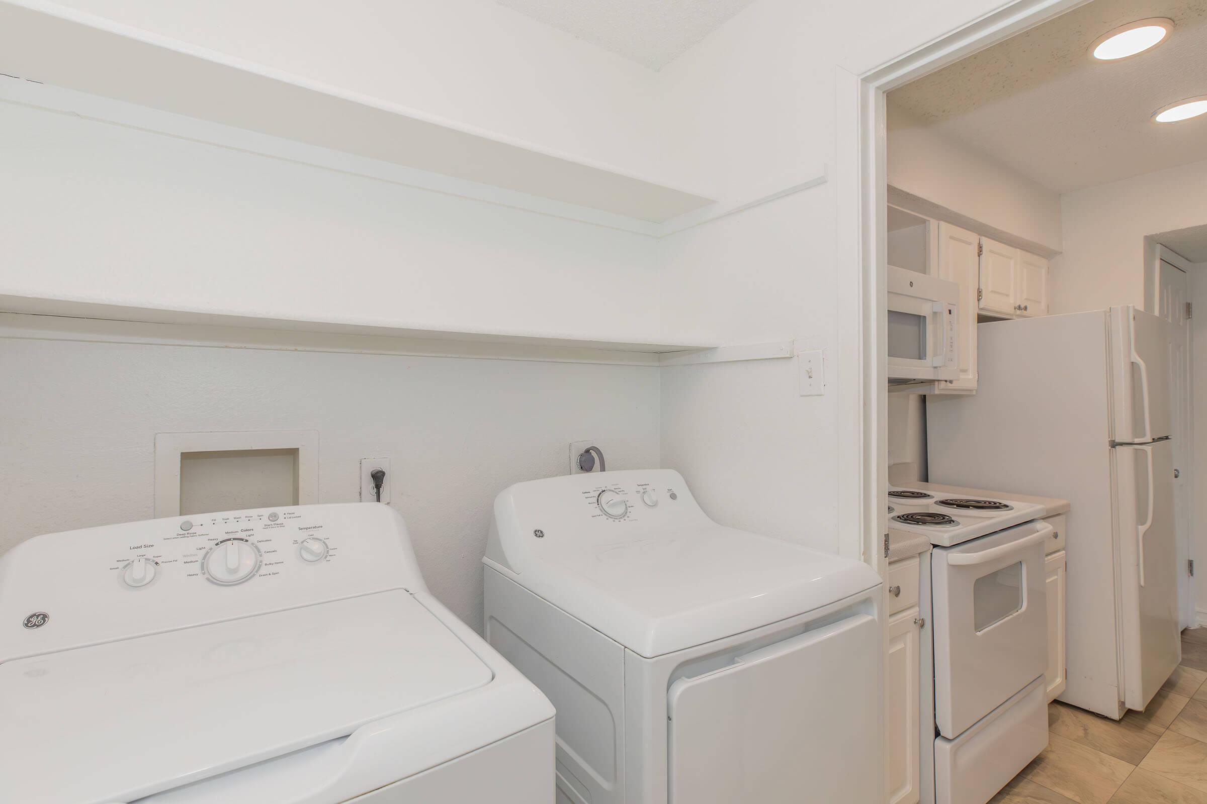 a kitchen with a sink and a refrigerator