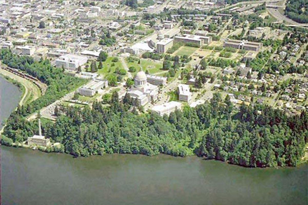 a large body of water with a city in the background