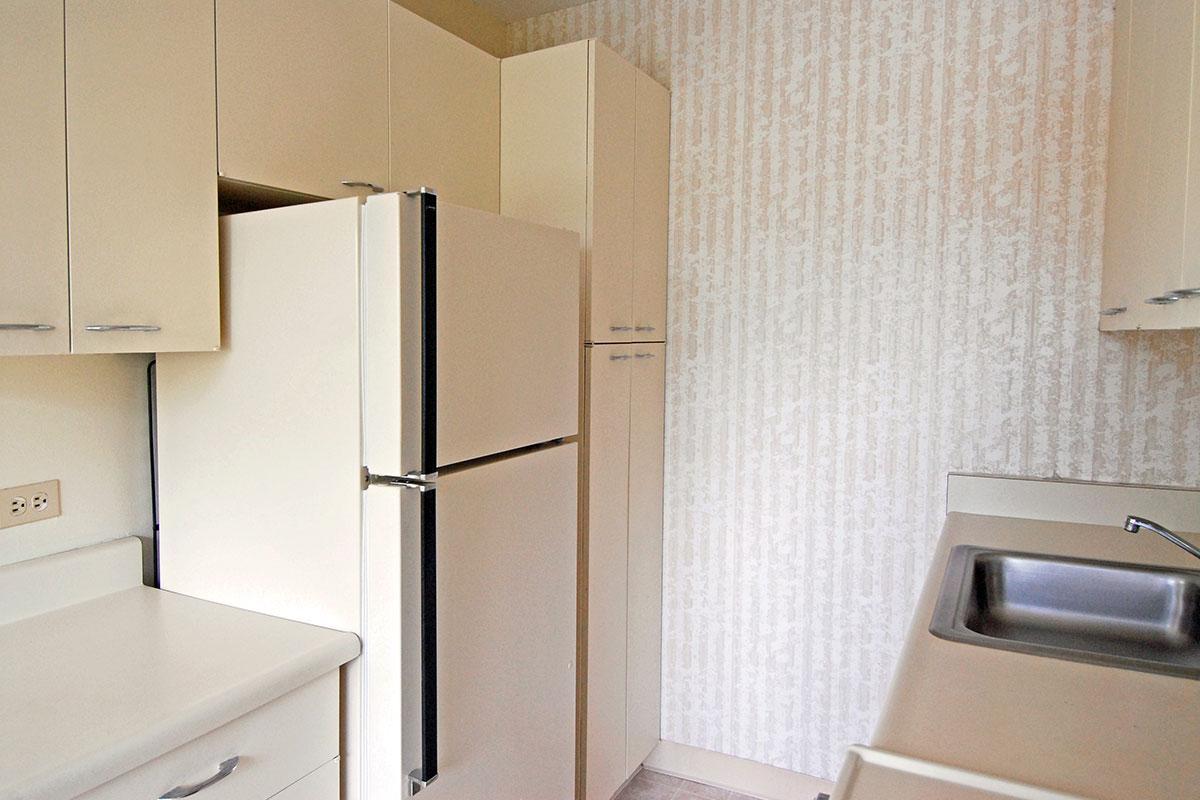 a stainless steel refrigerator in a kitchen