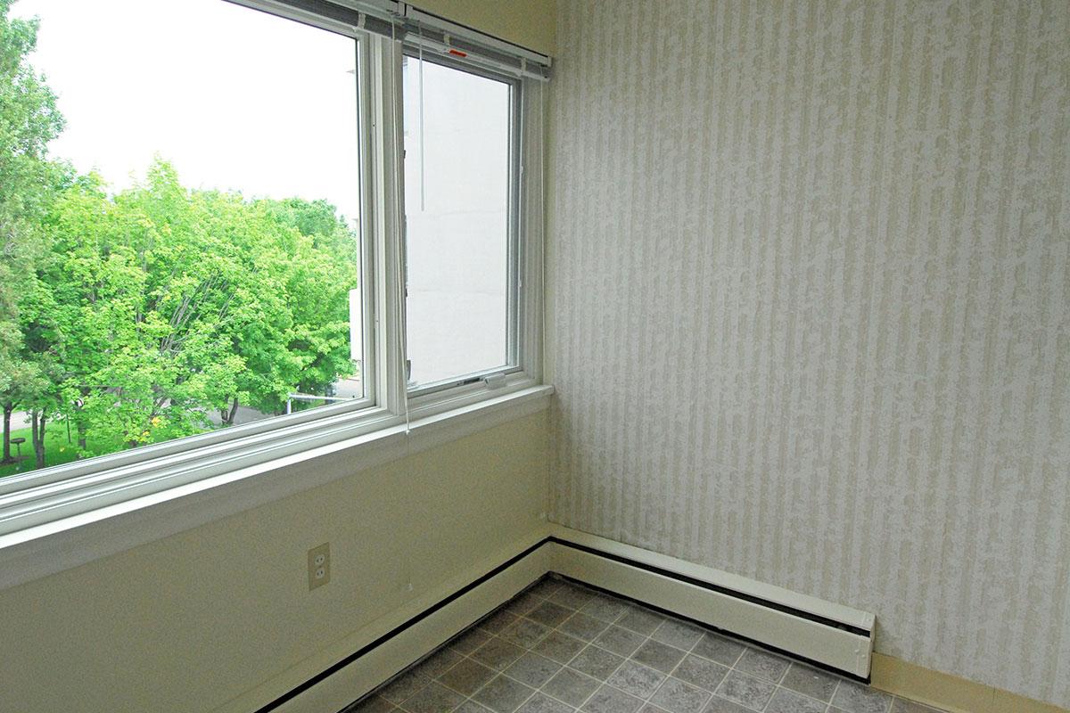 a white sink sitting under a window
