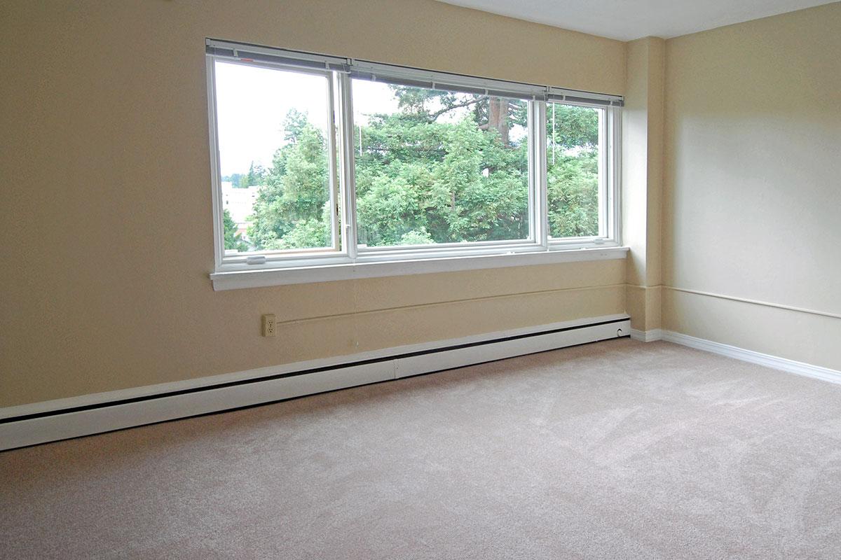 a bedroom with a large window
