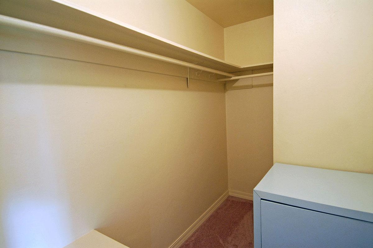 a bedroom with a bed and a mirror