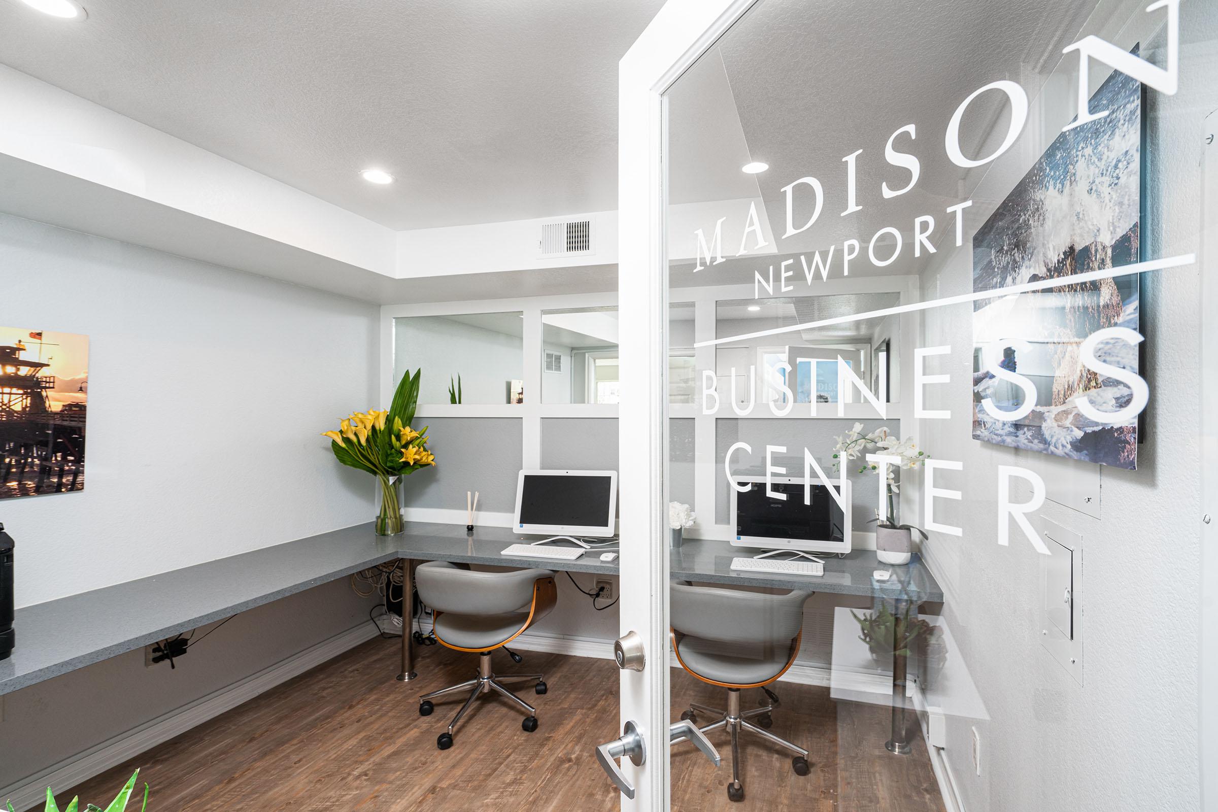 furnished business center with a glass door