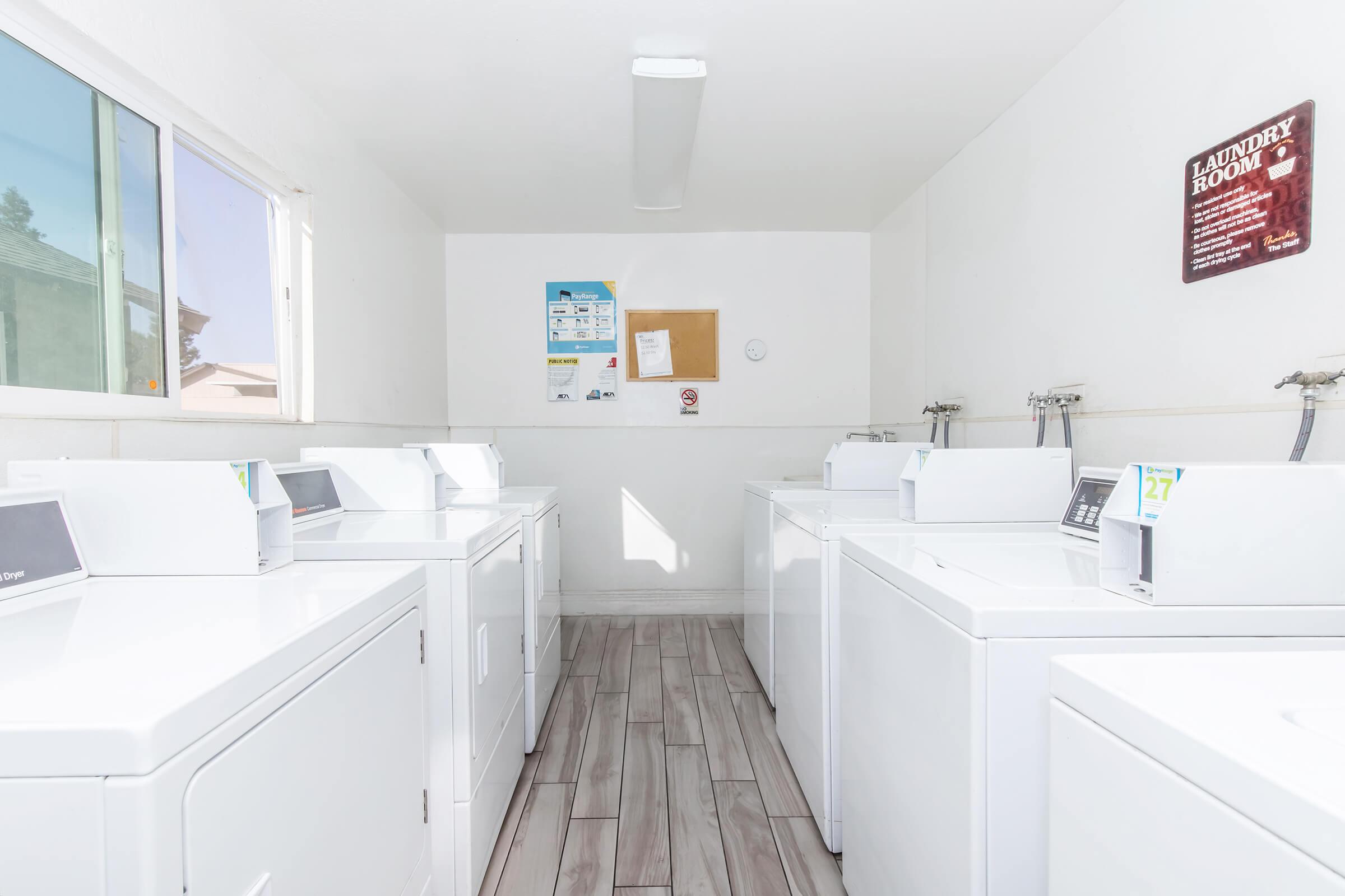 a kitchen with a sink and a refrigerator